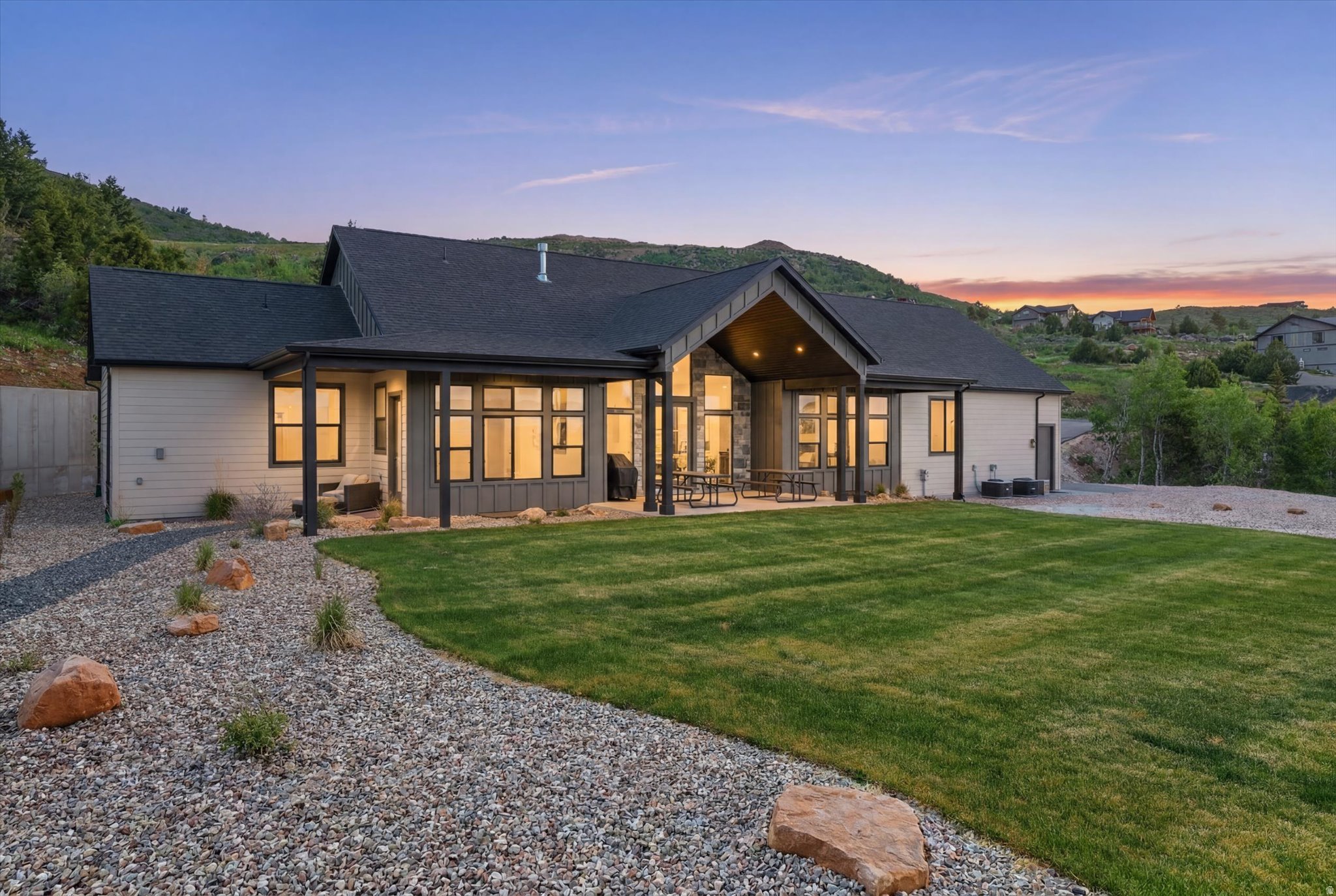 Beautiful new home located in a quiet cul-de-sac in Eagle Feather at Shundahai, surrounded by towering pines and quaking aspens with views of Bear Lake. Designed for both comfort and entertaining, this spacious mountain retreat features 8 bedrooms and 8 bathrooms, with most bedrooms offering private en-suite baths. The open-concept floor plan includes two generous living areas, each with its own fireplace, creating inviting spaces for gathering with family and friends. A covered deck and covered patio provide the perfect setting to relax and take in the beautiful mountain and lake scenery. Adding exceptional flexibility, the property includes a separate ADU above the garage featuring a private one-bedroom suite and a wet bar/mini kitchen, ideal for guests or additional rental potential. Short-term rentals are allowed, making this property an excellent investment opportunity or vacation retreat. Outdoor recreation is just minutes away with access to The Sinks and Cache National Forest, offering hundreds of miles of ATV/UTV and snowmobile trails, as well as hiking and mountain biking. Beaver Mountain Ski Resort is only 15 minutes away, while downtown Garden City, with its shops and dining, and Bear Lake State Park Marina are just 5 minutes from the property. Offered below appraised value, this is a rare opportunity to own a beautiful new home in one of Bear Lake's most desirable mountain communities.