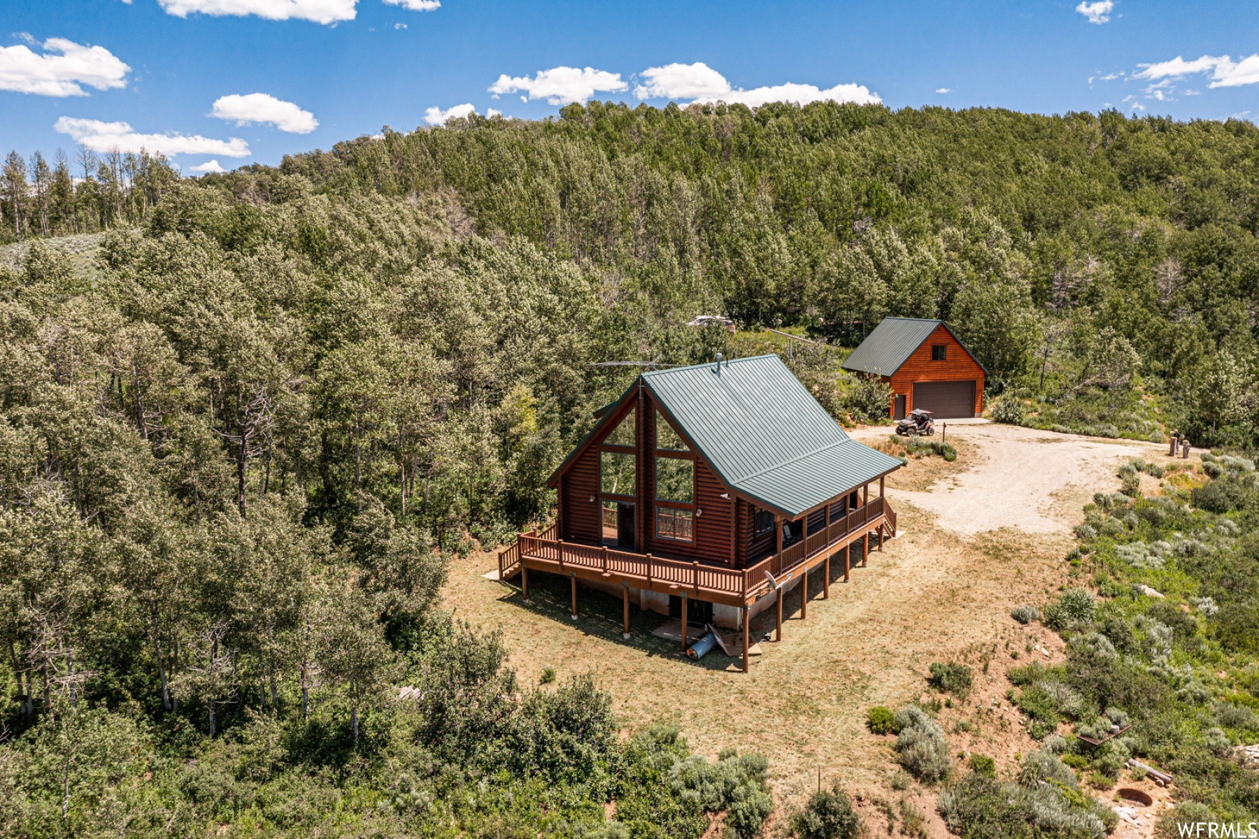 Extraordinary 60-acre private cabin retreat in Paradise, Utah offering unmatched seclusion, self-sufficiency, and panoramic mountain views. This incredible, fully furnished cabin is designed for gathering and longevity, with a garage loft sleeping up to 20, making it ideal for large groups and multi-generational use. The property is exceptionally well equipped with a private well with water rights, solar power, 2,000-gallon water storage, 500-gallon propane tank, and a backup generator, providing comfort and reliability year-round. A private ski hill creates a rare winter playground, while summer brings wide-open space and breathtaking scenery. Access is snowmobile-only in winter, enhancing the privacy and adventure of this truly one-of-a-kind setting. A rare opportunity to own a legacy mountain property where memories are made for generations to come.