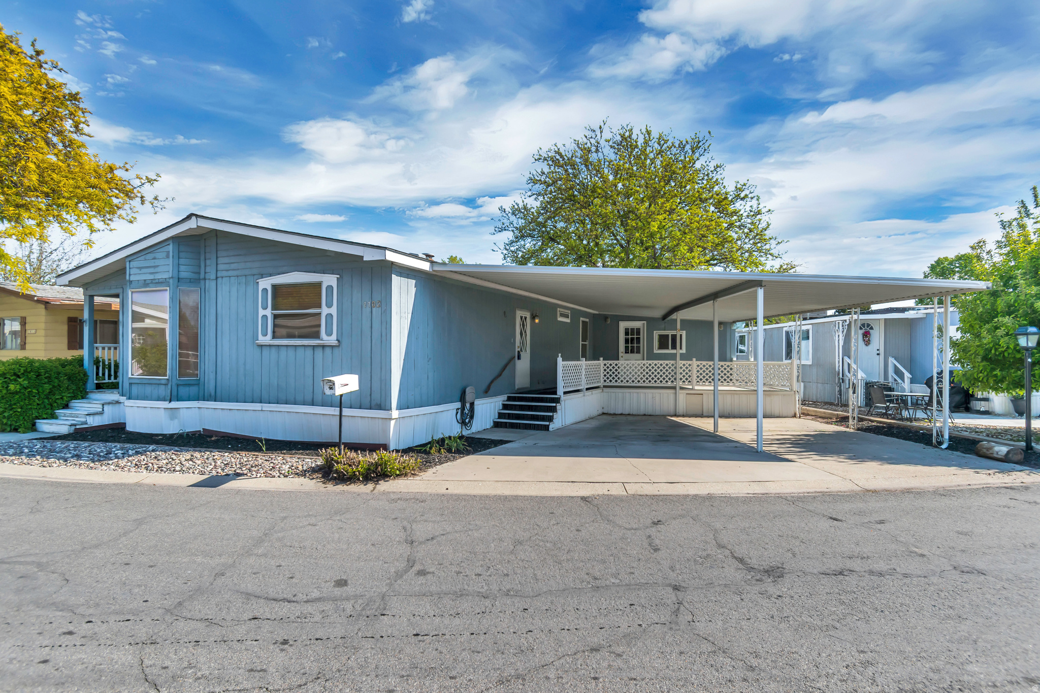 Spacious and well-maintained mobile home featuring a large, open living room perfect for relaxing or entertaining. This home offers 3 bedrooms and 2 full bathrooms, providing plenty of space for comfortable living. Enjoy the fully fenced yard ideal for pets, kids, or outdoor gatherings. A standout feature is the double carport, the only one in the entire community, offering rare and valuable covered parking. Plus, an indoor shop with gas plumbing gives you the perfect space for projects, hobbies, or extra storage. This home truly combines comfort, convenience, and unique extras you won't find elsewhere. Shop has gas line.
