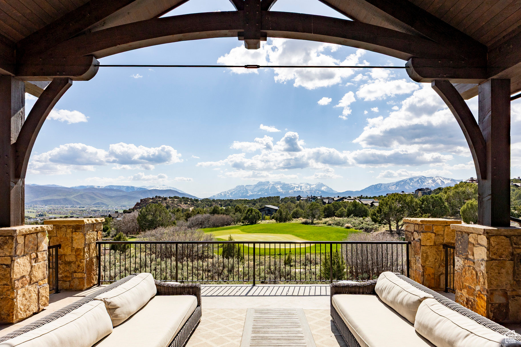 Set on a unique .74-acre lot in the exclusive Red Ledges community, this stunning home backs to the 10th green of the Jack Nicklaus Signature Golf Course, offering sweeping views of the golf course, Red Ledges' iconic red rock cliffs, and Mount Timpanogos.  With 8,297 sq. ft. of thoughtfully designed living space, this home features a theater room, indoor sports court, and high-end finishes throughout. The expansive back deck is perfect for entertaining or relaxing while taking in the breathtaking scenery.  Whether you're looking for a luxury full-time residence or mountain retreat, this property delivers privacy, elegance, and direct access to one of Utah's premier golf communities. A Red Ledges Golf Membership is available with deposit.