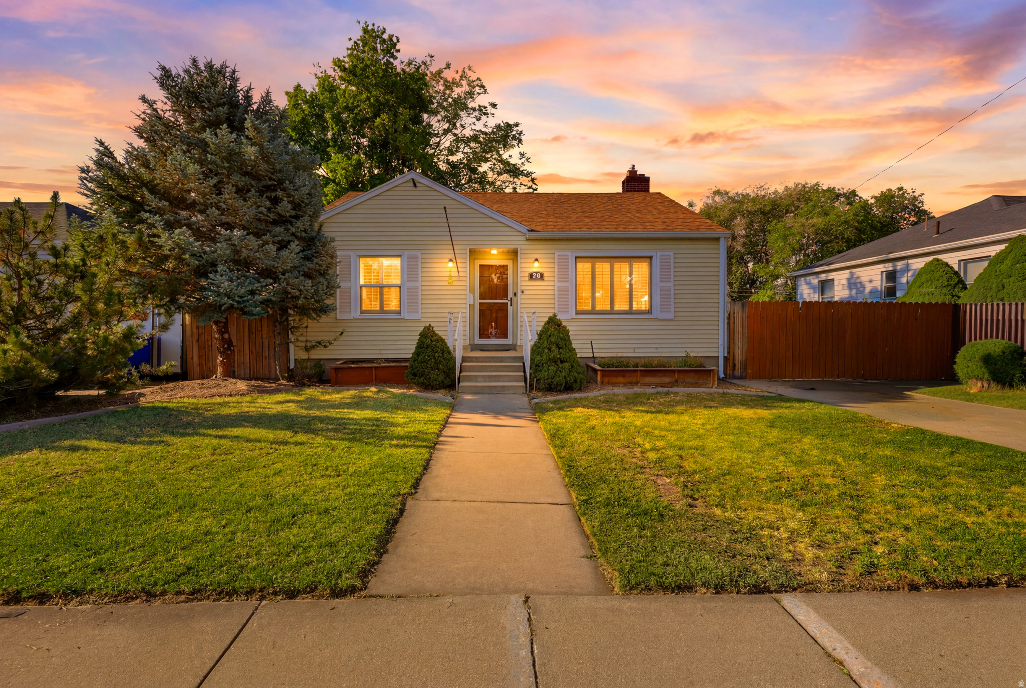 Imagine not having to choose between affordability and  lifestyle. This move-in-ready South Salt Lake bungalow offers the freedom of single-family living with no HOA, a private yard, large garage, RV parking, and a central location that keeps you connected to the best of the Salt Lake Valley.  Inside, the home is updated with the amenities that support modern living while maintaining original character, including hardwood floors, plantation shutters, an updated kitchen with gas range, central air conditioning, fiber internet, 3 bedrooms, 2 full bathrooms, and a finished basement that adds a flexible space for work, guests, hobbies, workout or movie nights.  The backyard is the true standout. Designed for everyday enjoyment and easy entertaining, the fully fenced outdoor space features a covered patio, sunken Trex seating area with propane firepit, outdoor projector area, mature landscaping, low-maintenance, and mountain views.  The extra-wide detached two-car garage with workbench, drive-through access, RV parking, and space for up to six vehicles adds practical function that is hard to find at this price point.  Minutes from downtown Salt Lake City, Sugar House, Millcreek, Murray, local dining, coffee shops, freeway access, parks, and year-round recreation, 49 E Sunset Ave delivers character, convenience, outdoor living, and ownership freedom in one smart package.