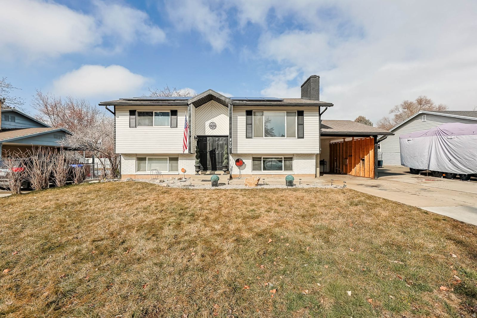Welcome to a beautifully maintained home nestled in one of North Ogden's established neighborhoods. This property combines stunning mountain views, a functional layout, and thoughtful updates that make it truly movein ready * The main level offers bright, open living spaces with plenty of natural light, new LVP Flooring, a Remodeled Kitchen (2020) with White Cabinetry, Stainless Appliances, Quartz Countertops, and an Island Bar... perfect for everyday living or entertaining * Moreover, the home features a new Gas Fireplace, new Lighting, new Vanities in the bathrooms, newer HVAC (2024), new AC Condenser, new Electrical Panel, and Solar Panels (Providing a great Discount on Electricity - Balance will be Paid in Full by Seller)  *  The lower level adds even more versatility with additional living space ideal for a family room, home office, or guest accommodations * Step outside to a private backyard framed by mature landscaping and panoramic mountain scenery - an ideal setting for quiet mornings, gatherings, or simply enjoying Utah's four beautiful seasons * With its convenient location near parks, schools, shopping, and outdoor recreation, this home offers the perfect blend of comfort and convenience.
