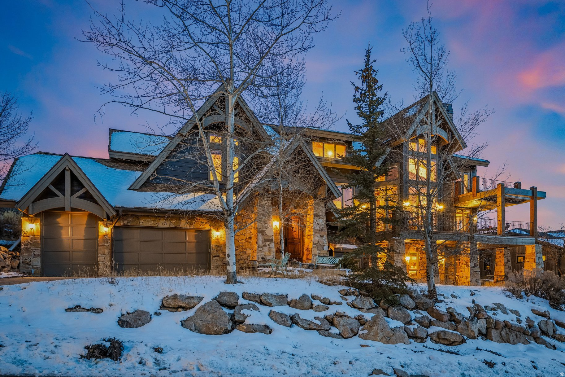 Inspired by classic Deer Valley mountain style, this exceptional legacy residence showcases panoramic views, vaulted ceilings, and floor-to-ceiling glass filling the great room with natural light while framing the surrounding landscape. Designed by renowned architect Michael Upwall, the home spans over 7,300 square feet, offering five generously sized bedrooms, six bathrooms, and a thoughtful balance of warmth, scale, and livability. Wood-burning fireplaces, a large chef's kitchen, formal dining area, and multiple entertaining spaces-including a private screening room and billiard area  create an ideal setting for hosting family and friends. Savor the mountain scenery and unforgettable sunsets from expansive windows and outdoor living areas, enjoying unobstructed views stretching for miles. Radiant floor heating, multiple decks, a three-car garage, mudroom, and thoughtfully planned storage areas and closets ensure effortless comfort and convenience for year-round living. Located in the prestigious Hidden Oaks neighborhood just minutes from Deer Valley Resort and Park City's world-class skiing, this rare residence captures the true essence of the Park City mountain lifestyle-an enduring retreat designed to host many and last for generations.