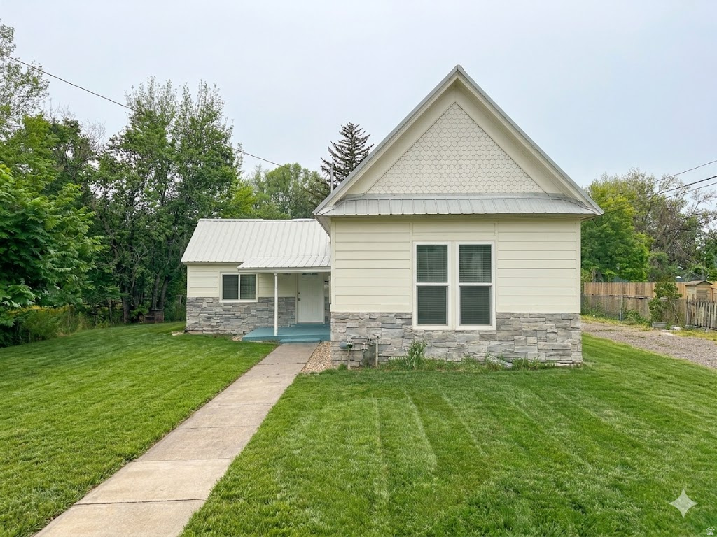 Charming and completely updated cottage-style home featuring 1 bedroom and 1 bathroom with a beautifully refreshed interior throughout. This move-in ready home offers a brand-new everything! New kitchen with new appliances, cabinets, countertops, flooring, and new fresh paint. The spacious bathroom includes a new tub/shower with elegant tile surround. Just off the kitchen, the bright family room is filled with natural light and your cozy warm fireplace! Outside, you will find a huge backyard with a peaceful retreat filled with mature shade trees. Best location in Logan as it is near Utah State University and close to shopping, dining, and everyday conveniences, this home offers comfort, charm, and convenience in a very desirable neighborhood.