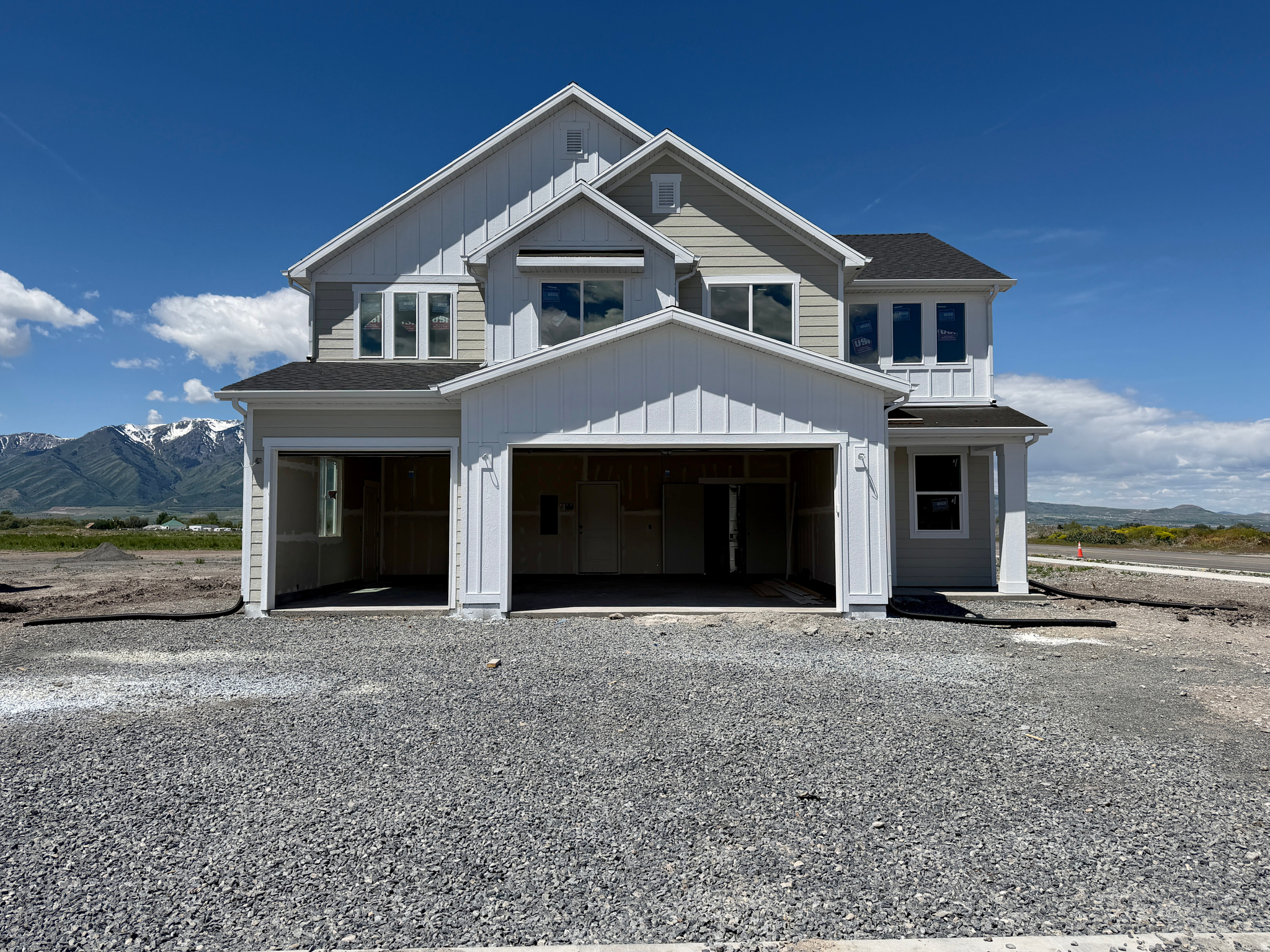 Coming in mid-June, this stunning, 2-story home with 3-car garage, grand entry, and open-concept layout featuring 9' ceilings and LVP flooring on the main level. The kitchen includes painted white cabinets on the perimeter, with SW Ellie Gray island, quartz countertops, a single basin sink, and an electric range (stubbed for gas). Upstairs offers a spacious primary suite with tray ceiling, separate tub/shower, 3 additional bedrooms, a loft/family room and laundry. Beautiful stair railing, modern finishes, and natural light throughout. Builder is offering a 3% credit to your closing costs or rate buy-down when using our preferred lender. Estimated Completion: June 19, 2026