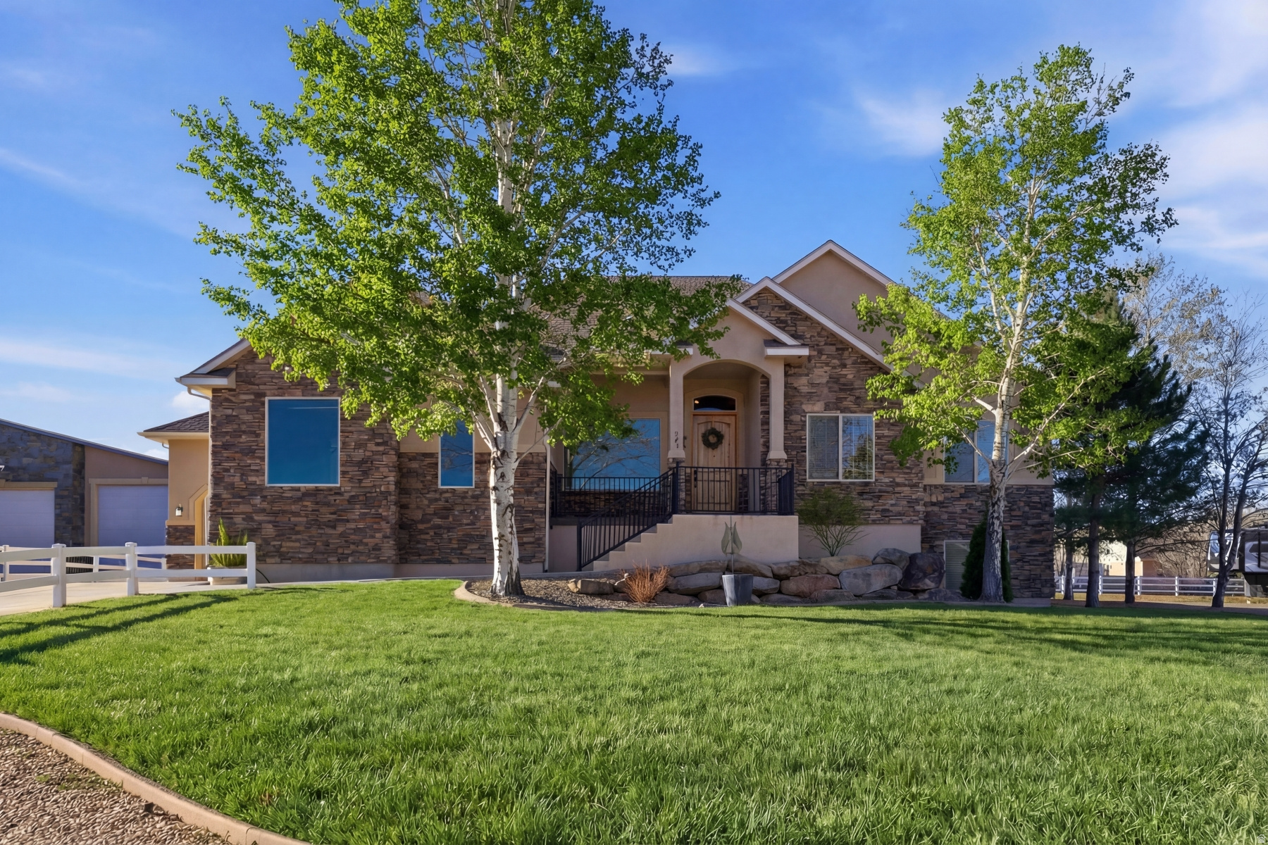 Experience the best of Utah living in this impeccable 5-bedroom, 3.5-bathroom retreat. Located in the coveted Wild Willow subdivision, this horse-zoned property is a dream for outdoor enthusiasts. Whether you're heading 20 minutes to the new East Deer Valley ski area, the Uinta Mountains or minutes to Jordanelle Reservoir, you are perfectly positioned for year-round recreation. The main level boasts an airy, open layout under soaring vaulted ceilings, featuring a dedicated home office with a picturesque window. For the hobbyist, the 3-car oversized garage PLUS a 26x36 detached garage provides limitless room for toys and workshop space. The lower level is a fully equipped mother-in-law apartment with a private entrance-ideal for guests or extended family. Relax in the six-person hot tub or around the custom fire pit after a day on the trails.