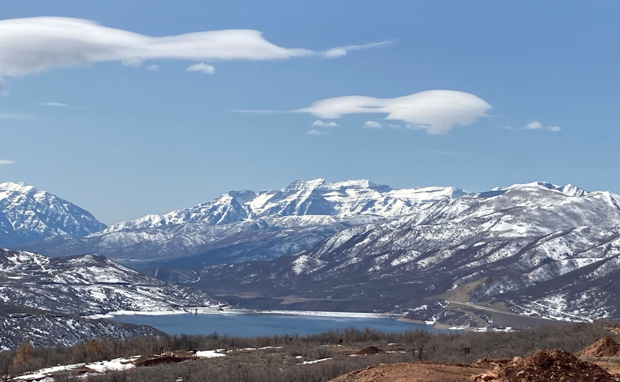 An exceptional opportunity to secure a premier homesite within Golden Eagle, offering sweeping 180-degree views across Kamas Valley, Mount Timpanogos, and Deer Valley East. Set on one of the community's larger parcels, this south-facing, downhill lot is thoughtfully positioned to capture abundant natural light while ensuring a remarkable sense of privacy, bordered by dedicated open space above, below, and along its eastern edge.  The setting is both tranquil and visually compelling, with a topography ideally suited for a sophisticated mountain residence designed to embrace expansive views and seamless indoor-outdoor living.  Located just 12 minutes from Deer Valley East, the property affords effortless access to world-class skiing, as well as hiking, biking, golf, fishing, and boating-offering a year-round lifestyle defined by outdoor recreation and natural beauty.  Approved building plans are available, presenting a rare opportunity to expedite the creation of a custom retreat in one of the area's most coveted settings.  A truly distinguished homesite-ready to bring a legacy mountain residence to life.
