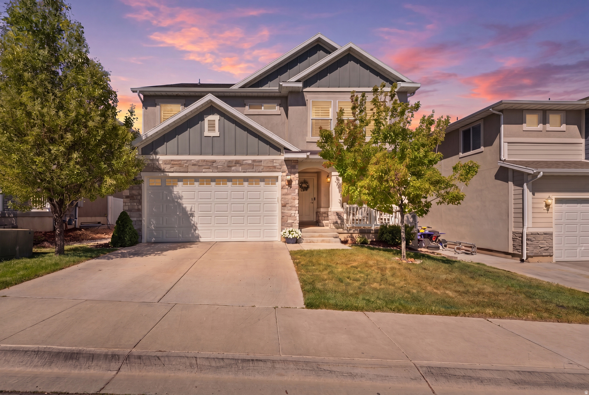 Stunning 2-story home in the heart of Herriman featuring 5 spacious bedrooms and countless upgrades throughout. The open-concept family room boasts soaring two-story ceilings, expansive windows that fill the space with natural light, custom built-ins, and a cozy fireplace, creating the perfect gathering space. The kitchen is a showstopper with a large island, upgraded quartz countertops, stylish tile backsplash, and plenty of room for entertaining and everyday living. Upstairs, you'll find generously sized bedrooms connected by a convenient Jack-and-Jill bathroom, along with a spacious primary bedroom with an en-suite bath with a separate tub and shower. This home is loaded with thoughtful upgrades, including custom wall features, plantation shutters, a built-in Murphy bed in the basement, permanent outdoor lighting, a reverse osmosis system, and paid-off solar panels providing peace of mind and energy savings with low monthly power bills. Located in an incredible Herriman location close to schools, shopping, dining, and entertainment. Just minutes from Mountain View Village, Costco, and the upcoming Trader Joe's and Target, this home truly offers the perfect combination of comfort, style, and convenience.   Square footage figures are provided as a courtesy estimate only.  Buyer is advised to obtain an independent measurement.