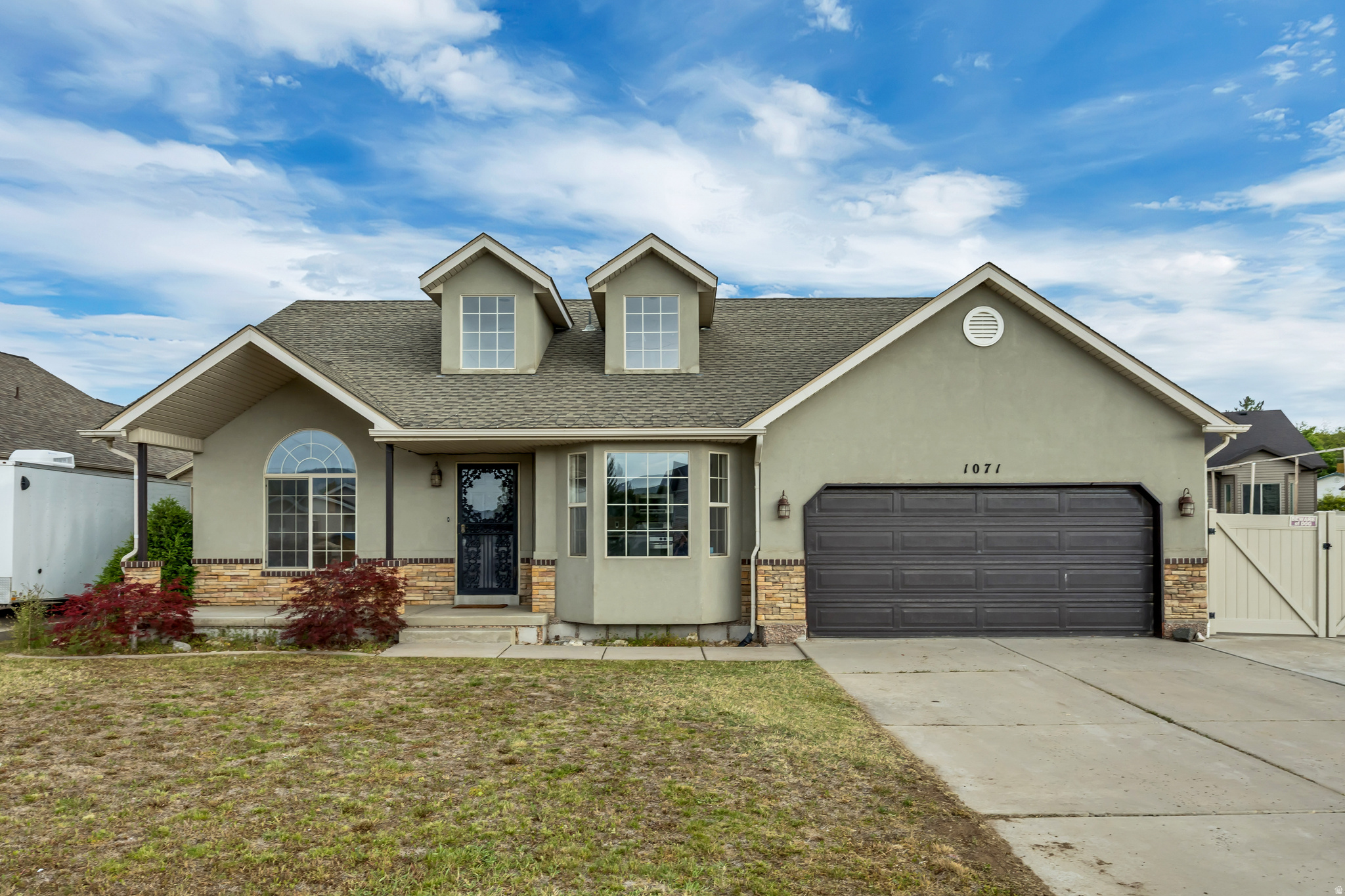 This well maintained home is filled with thoughtful upgrades and unique custom touches throughout. From the upgraded doors, new carpet, hardwood floors, and baseboards to the stunning custom rock and woodwork, this home offers warmth, character, and craftsmanship in every space.  Relax and unwind in the private, partially enclosed hot tub room-creating the perfect retreat to enjoy year-round. The basement features a wet bar area, offering a great setup for entertaining or additional living space.  Storage will never be an issue with the extra-large crawl space, providing plenty of room for seasonal items, tools, and more.  This move-in ready home is ready for its next owner.   Owner has never lived in the home and will not be providing seller disclosures. Buyer to verify square footage. Home was virtually staged.