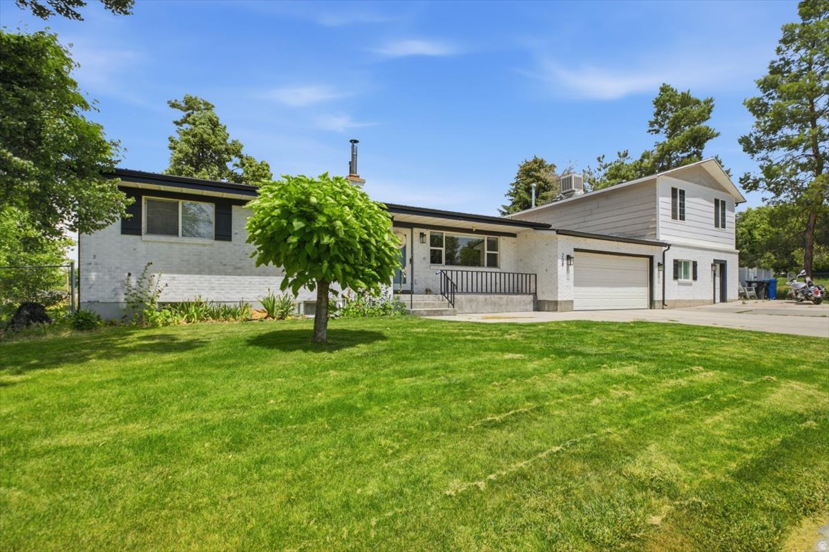 Beautifully remodeled rambler on 0.50 acres! Enjoy a new HVAC system and water heater (last year) updated electrical, remodeled bathrooms, new flooring, fresh paint, a new mudroom, and a gorgeous kitchen with quartz countertops and new appliances. A separate 2-bed, 2-bath Mother-in-Law apartment is currently rented for $1,055/month, offering great income potential. The property also features mature fruit trees, one water share, and a separate oversized garage, shop, and barn with separate street access. All appliances are included. Buyer to verify all information.  Buyer may apply with the city to convert the mother-in-law to an ADU.