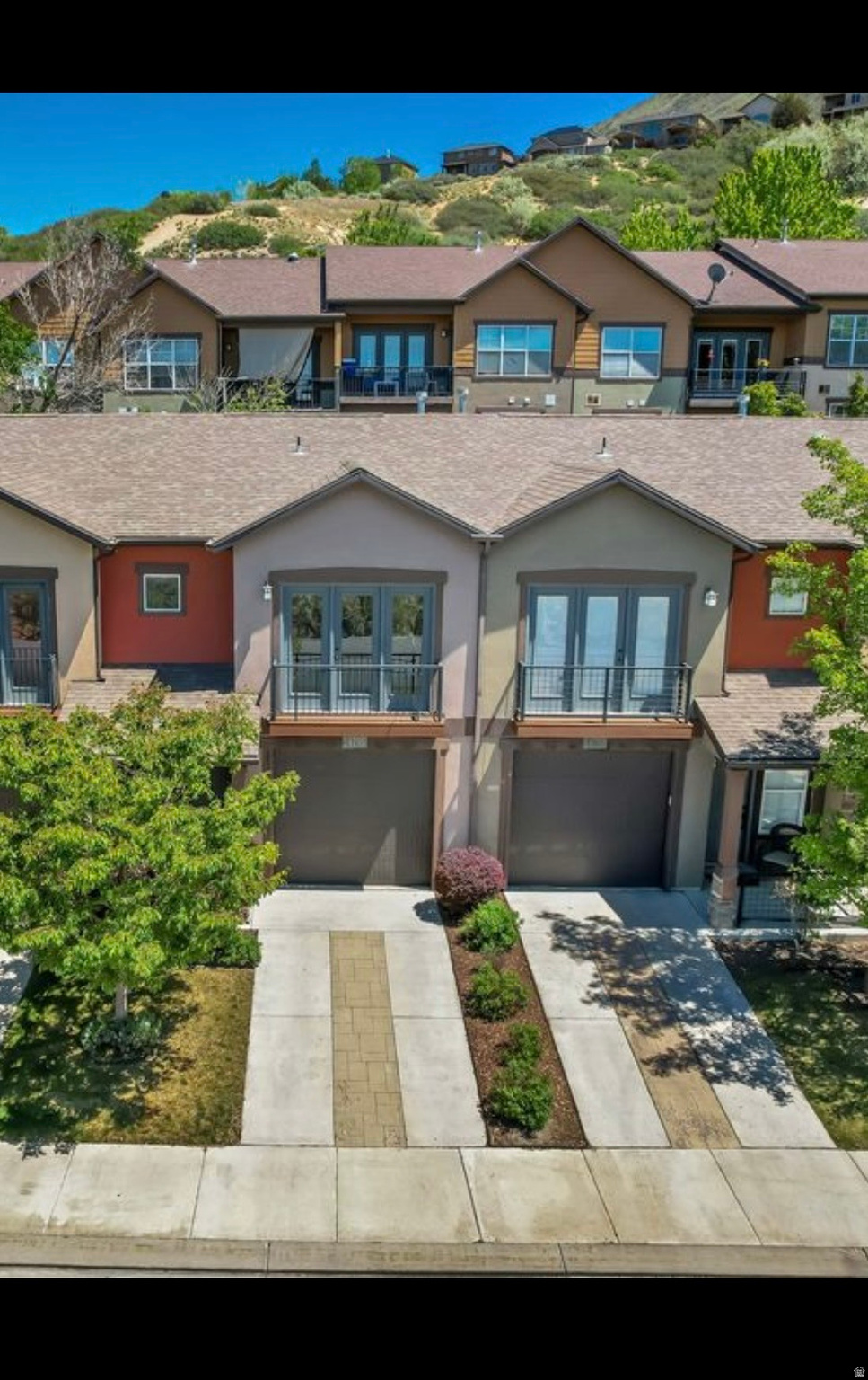 Beautifully updated 2-bedroom, 2.5-bath townhouse in the highly desirable Chandler Pointe community in Draper. This move-in ready home features an open-concept floor plan with bedroom vaulted ceilings, abundant natural light, and new LVP flooring throughout. The updated kitchen includes granite countertops, modern cabinetry, a large island, new appliances, a water softener, and reverse osmosis drinking water filtration. Both spacious bedrooms feature private en-suite bathrooms and walk-in closets. Enjoy mountain backdrop views from the rear of the home and beautiful Salt Lake Valley views from the front. The attached extra-length one-car garage offers additional storage. HOA includes water, garbage, exterior insurance, yard maintenance, snow removal, clubhouse, community pool, and hot tub. Conveniently located near I-15, shopping, restaurants, parks, and served by Draper Elementary, Draper Park Junior High, and Corner Canyon High School. Turn-key, low-maintenance living in one of Draper's most desirable communities!