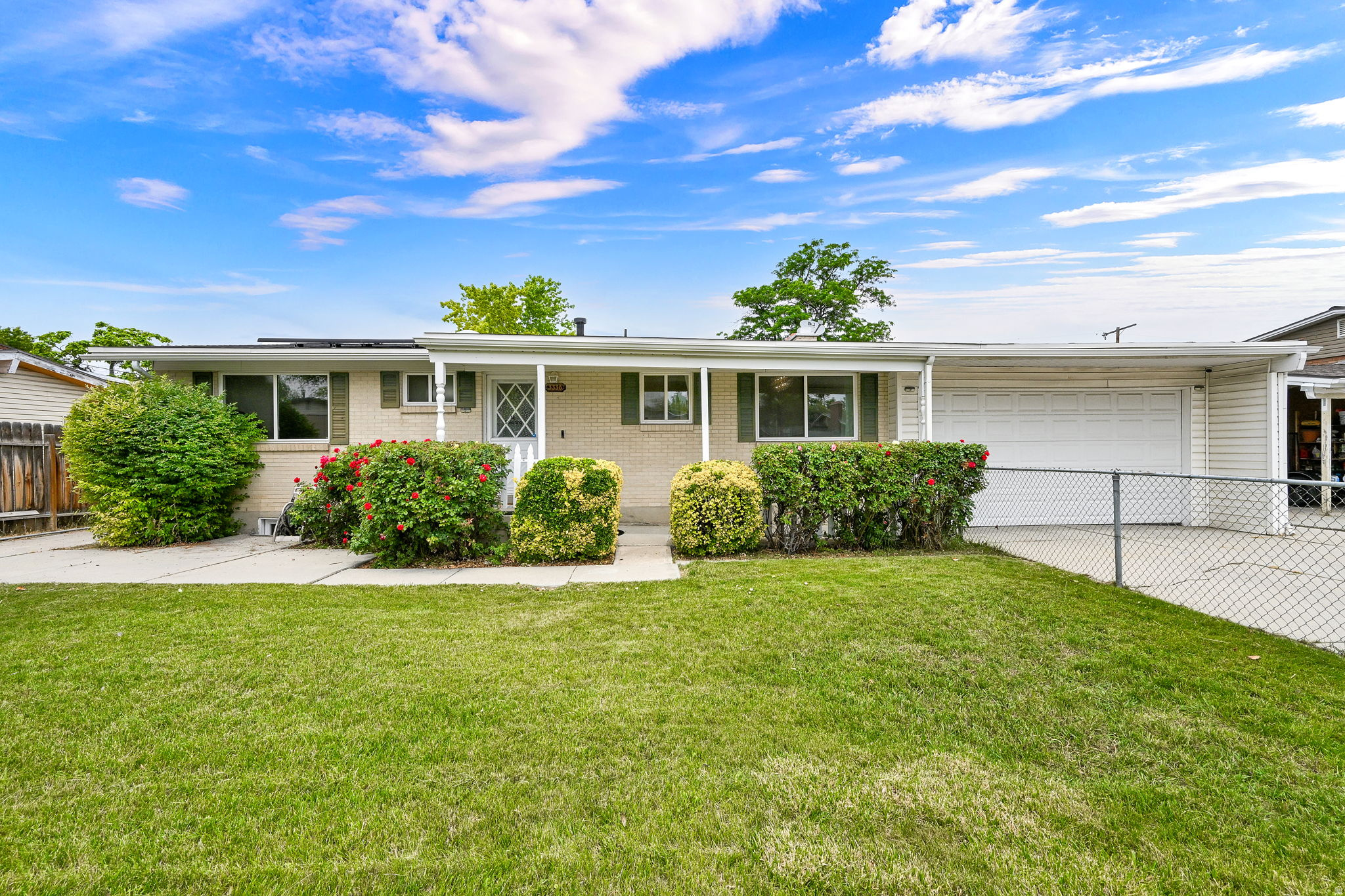 Nestled in a peaceful, well-maintained neighborhood, this beautiful home offers the perfect blend of comfort, convenience, and versatility. Enjoy easy access to nearby walking and biking trails, shopping, and everyday amenities. Designed with flexibility in mind, the second kitchen downstairs is ideal for multi-generational living, hosting extended guests, or creating potential rental income opportunities. The main kitchen features granite countertops, maple cabinetry, stainless steel appliances, and abundant storage space. The inviting family room showcases genuine hardwood flooring and a cozy fireplace. Step outside to a private, fully fenced backyard complete with a covered patio perfect for relaxing or entertaining year-round. New energy-efficient windows enhance comfort throughout the home while helping reduce outside noise and utility costs, and the INCLUDED solar panels provide added energy savings and efficiency. This exceptional property combines thoughtful upgrades, functional living space, and a desirable location you'll love coming home to.
