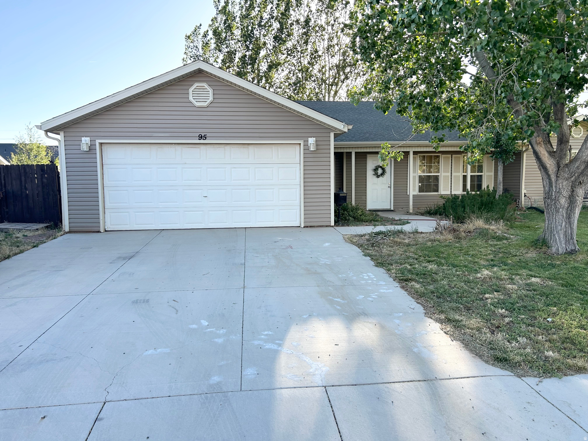 Charming Home on a Quiet Street  Move-In Ready with No HOA!  This beautiful home features a spacious open floor plan highlighted by soaring vaulted ceilings in the living room, kitchen, and primary suite. Fresh paint and brand-new carpeting enhance the entire interior. The primary bedroom boasts an adjoining generous walk in closet and bath with a dual-sink vanity, shower, and garden tub.  Private Retreat: Fully fenced backyard shaded by large, mature trees, complete with a permanent storage shed.  Parking & Storage: Attached 2-car garage plus dedicated additional parking for utility trailers, boats, or toys.  Bonus Perks: Located on a peaceful, low-traffic street. Central air conditioning ensures year-round comfort, and all appliances are included!  Cedar City is also located just a short day trip from any of the 5 national parks in southern Utah.