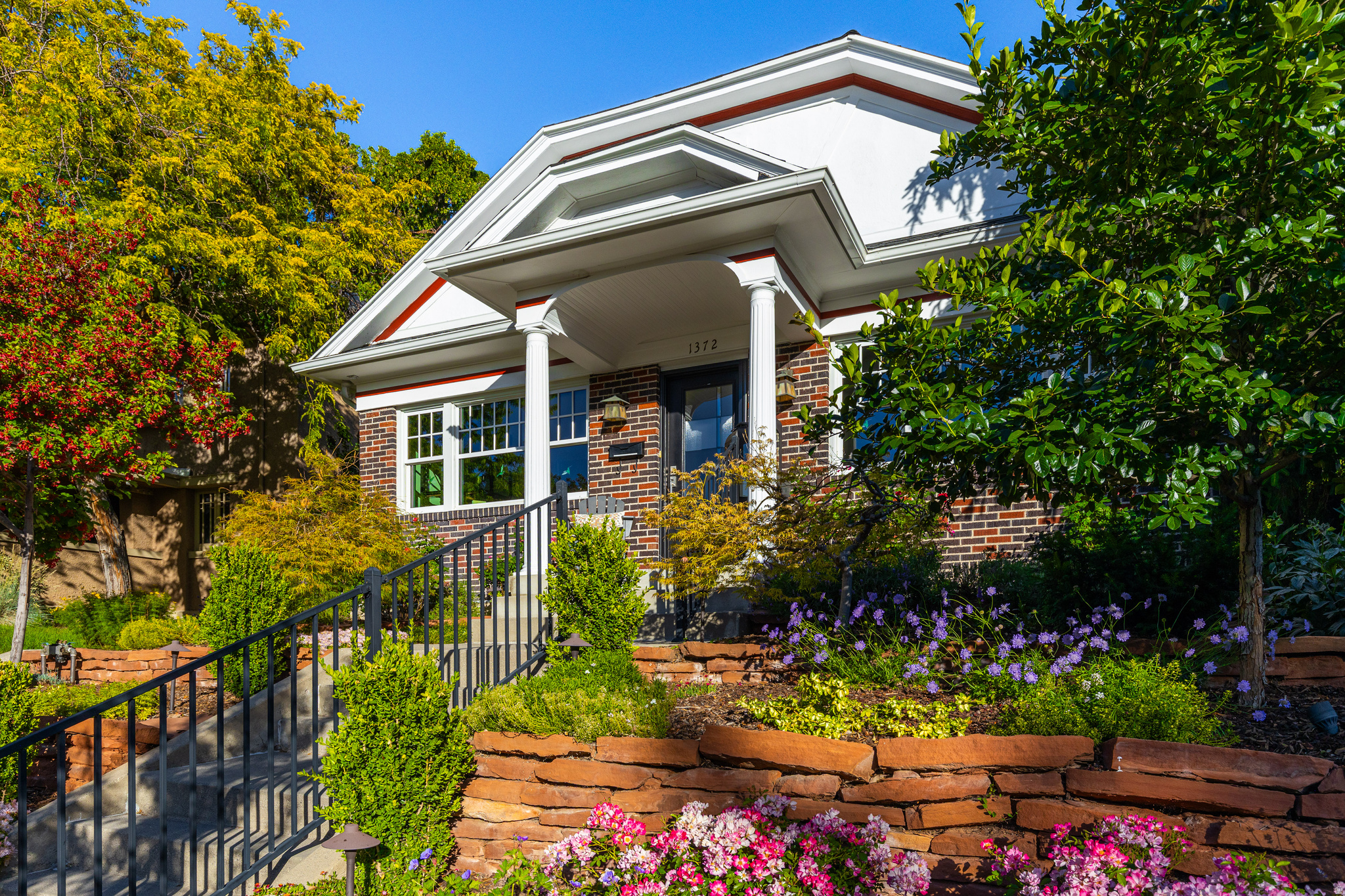 Nestled in the highly sought-after Federal Heights neighborhood, this beautifully designed bungalow-style brick residence seamlessly blends timeless 1926 character with thoughtful modern updates. Offering just over 2,700 square feet of living space, this exceptional home features 4 bedrooms, rich hardwood flooring, an updated kitchen and inviting living areas filled with warmth and charm. French doors open to a private outdoor patio retreat surrounded by mature landscaping, creating the perfect setting for entertaining or enjoying a quiet evening. The lower level includes generous-sized bedrooms and a spacious family room, providing flexible living space for guests, recreation or a home office. Significant improvements include a new roof, solar and a two-car garage with dual entry access. The premier location places you just minutes from downtown Salt Lake City, the University of Utah, hospitals, parks, hiking trails, dining and cultural attractions. Combining architectural charm, tasteful updates and an unbeatable location, this Federal Heights gem presents a rare opportunity to enjoy one of Salt Lake City's most desirable neighborhoods.  Buyer to verify all information.