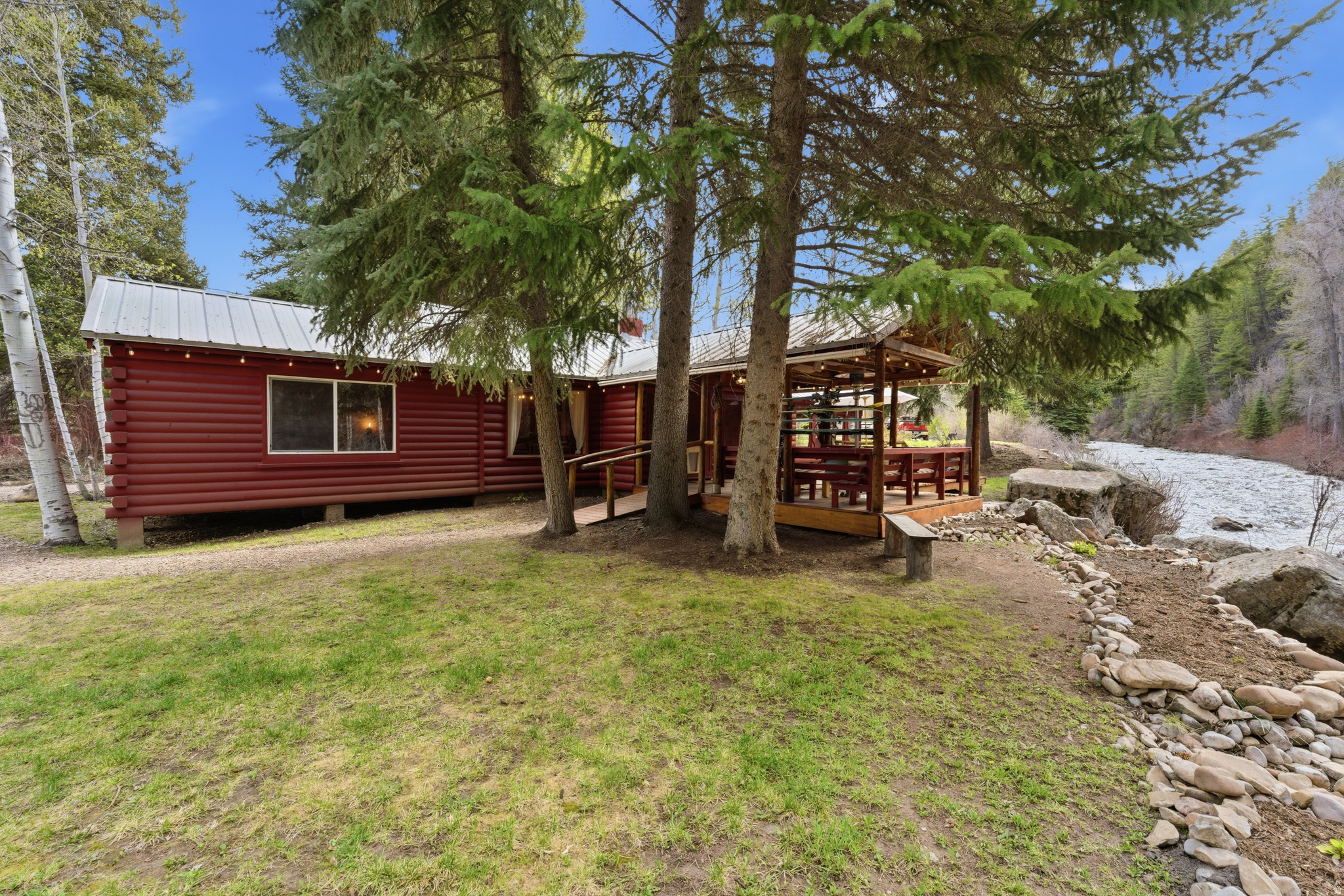 Your next cabin in the woods, set within a rare, grandfathered community at the foot of the Uinta Mountains. Situated on approximately two thirds of an acre and bordered by two bodies of water, this one-of-a-kind property offers a level of privacy and natural beauty that is increasingly hard to find in Utah. Nestled among aspens and pines along the banks of the Provo River, the cabin feels both secluded and deeply connected to its surroundings. Wake each morning to the sound of the river and little else. Inside, the home features a comfortable, inviting layout with a spacious primary bedroom and picturesque views from every room, bringing the outdoors in. The outdoor living is just as special: a covered porch, a private stretch of riverbank that feels like your own beach, a fire pit, raised garden bed, and areas throughout to sit and take in the landscape. This is more than a home, it's a legacy property. A rare opportunity to own a piece of Pine Springs that you and your family can enjoy for generations. Agent is related to Seller.
