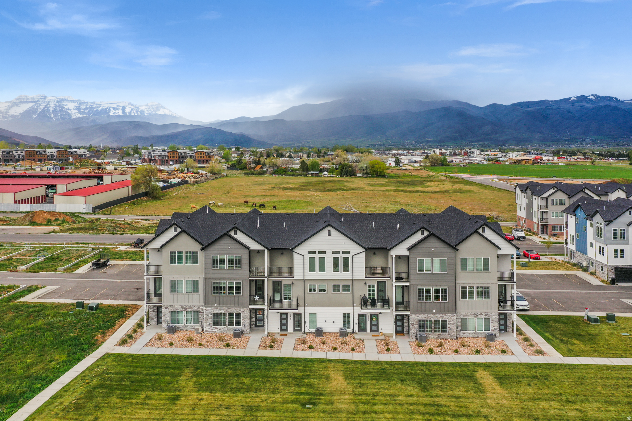 BUILDER AND LENDER INCENTIVES: 2/1 buydown for an interest rate as low as 3.99% for the first year! MUST SEE FOR YOURSELF- This stunning mid-row new construction townhome in Heber City's sought-after Sawmill community delivers the mountain lifestyle you've been waiting for - and with an included ADU... the financial flexibility to make it work. Spread across three thoughtfully designed levels, the main home features 3 bedrooms and 3.5 bathrooms, wide plank floors, soaring 9-foot ceilings, and a chef's kitchen with quartz island, shaker cabinets all framed by oversized windows with panoramic mountain views. Enjoy the open concept as the kitchen flows seamlessly into the living room and an additional flex space ready to suit your needs! Upstairs the primary suite features its own balcony deck and a spa-inspired ensuite and a huge walk-in-closet. Two more bedrooms with included ensuite bathrooms, a laundry room and huge storage/linen closet cap off the 3rd floor. On the first floor, the attached private ADU studio with its own entrance, kitchen, bathroom offers an opportunity to offset your mortgage each month OR works as the perfect home office/ business space. Pick you colors and finishes to customize your mountain haven! Resort-style HOA amenities include a pool, gym, pickleball courts and clubhouse (coming soon).