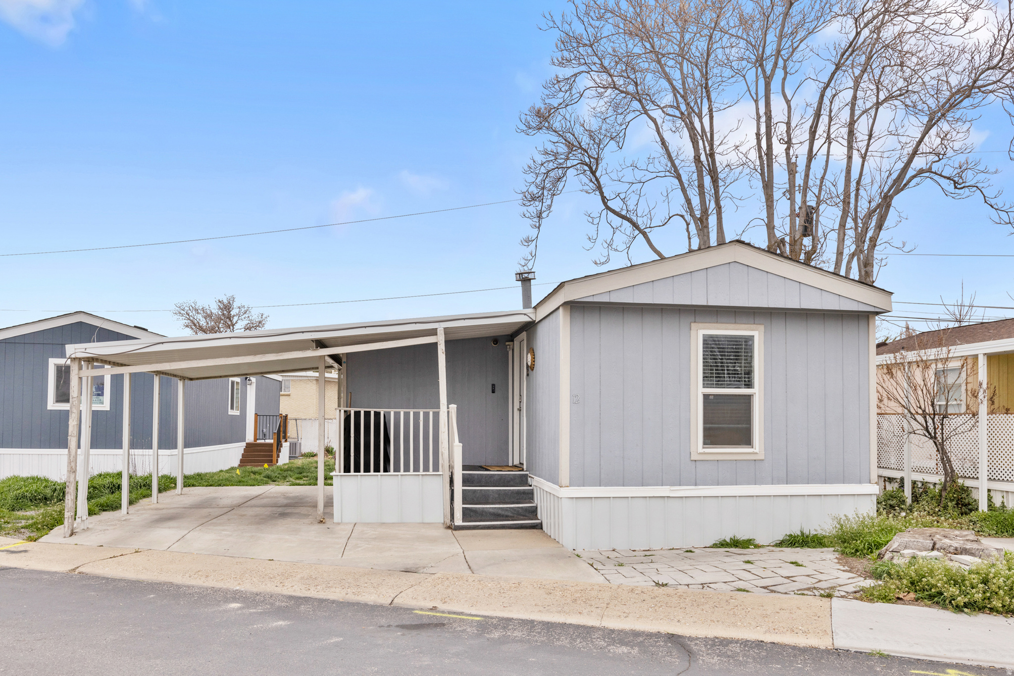*PRICE REDUCTION *  Charming 3-bed, 2-bath mobile home in Clearfield! This home offers a comfortable layout with plenty of space to relax. Enjoy the 2-car carport, large shed and take advantage of the community amenities note: buyers must be pre-approved with the park prior to move-in