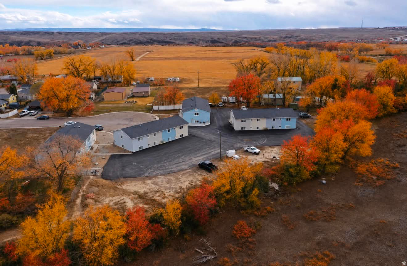 Excellent multi-family investment opportunity situated on 1.60 (parcel 1b-231-12 & 1b-231-11) acres 16 units total in Wellington. This well-maintained property offers strong rental income with room for long-term appreciation. Each unit rents for $850 per month Tenants pay $110 per month in utility reimbursement to the owner's property manager for Wellington City utilities (water & garbage) Tenants place Rocky Mountain Power and Enbridge Gas in their own names, reducing owner utility exposure. Newer stucco exterior and asphalt driveway. 8 units have received updates within the past 3 years, including: 8 Central Air Units New carpet, Fresh interior paint, Updated cabinets (in select units). Washer and dryers are tenant-owned. 4 video walkthroughs of different units available upon request. Please do not disturb the tenants.  This property presents a solid opportunity for investors seeking stabilized cash flow with improved exterior and interior updates already completed.  Square footage figures are provided as a courtesy estimate only and were obtained from Carbon County .  Buyer is advised to obtain an independent measurement.