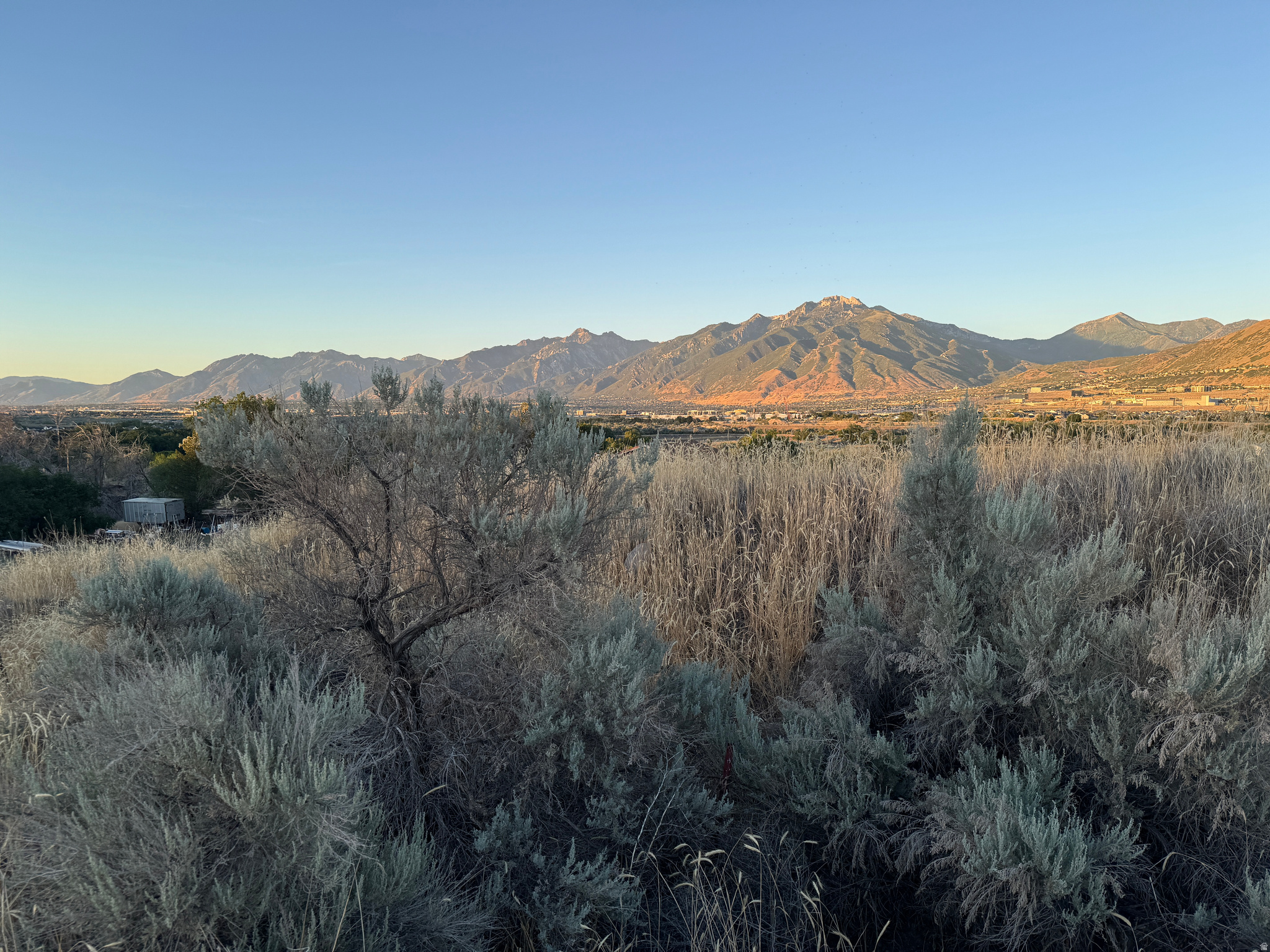 Discover this incredible 1-acre vacant lot in Bluffdale, a true hidden gem offering amazing privacy and stunning views. Priced below recent comparable sales in the $500K range, this lot presents a fantastic opportunity for recreation, storage, or future development. While it's not currently buildable without some work with the city, the discounted price reflects this, giving you room to navigate the next steps toward making it buildable. Whether you're looking for a private retreat or a strategic investment, this lot has great potential. Motivated seller! Submit your best offer!