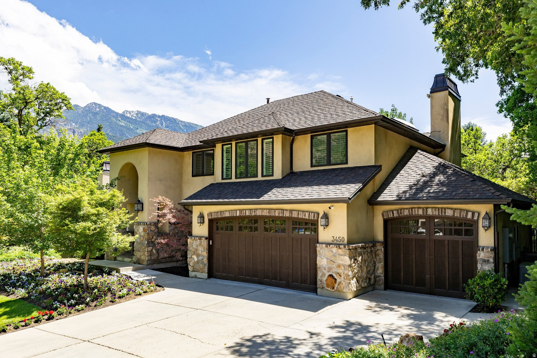 Nestled in the coveted Upper East Bench of Cottonwood Heights, this exceptional luxury residence offers over 5,200 square feet of refined living space on a private .49 acre lot with breathtaking mountain views. Featuring six bedrooms, 3.5 bathrooms, and a three-car garage, this beautifully updated home combines timeless craftsmanship, modern luxury, and an unparalleled outdoor lifestyle in one of Utah's most sought-after locations. A dramatic entry welcomes you into elegant formal living and dining spaces, a private office, all enhanced by a soaring vaulted beamed ceiling, abundant natural light, and a striking fireplace accented by a hand-carved mantel. Every detail throughout the home reflects enduring quality, thoughtful design, and a meticulous attention to detail. A newly renovated chef's kitchen designed for both entertaining and daily living is joined by a comfortable family room space, perfect combo for family get togethers. The line up in the kitchen includes Sub Zero refrigerator and freezer, Wolf appliances, six burner range, four ovens, warming drawer, microwave, and the ever popular pebble ice machine. The luxurious primary suite serves as a private retreat, featuring a delightful renovation with heated bathroom floors, steam shower, deep soaking tub and two oversized walk-in closets. Step outside to an extraordinary backyard designed for year-round enjoyment. Mature landscaping and towering trees create remarkable privacy while a resort-style swimming pool, waterfall feature, pizza oven, gas fireplace, trampoline, play set, swing, slide provide endless opportunities for relaxation and entertaining. Additional highlights include newer Pella efficient windows, plantation shutters, high efficient HVAC system, two year old 90 gallon water heater, and a 22-kilowatt propane powered back-up generator. The lowest level of the house provides walkout access to the amazing backyard for additional flexibility for family living. Located just minutes from Big and Little Cottonwood Canyons, you will enjoy immediate access to world-class skiing, hiking, biking, golf, and outdoor adventures. Shopping and dining are close and the Salt Lake International Airport is just 25 minutes away. A rare opportunity exists to purchase this property separately or together with the adjacent 3,300 ft. Luxury casita residence, creating an extraordinary multigenerational family compound. The detached residence offers a main-level primary suite, four bedrooms, 3.5 bathrooms, a two car garage and a creek that runs along the back of the house. This is an exceptionally uncommon offering in today's market.