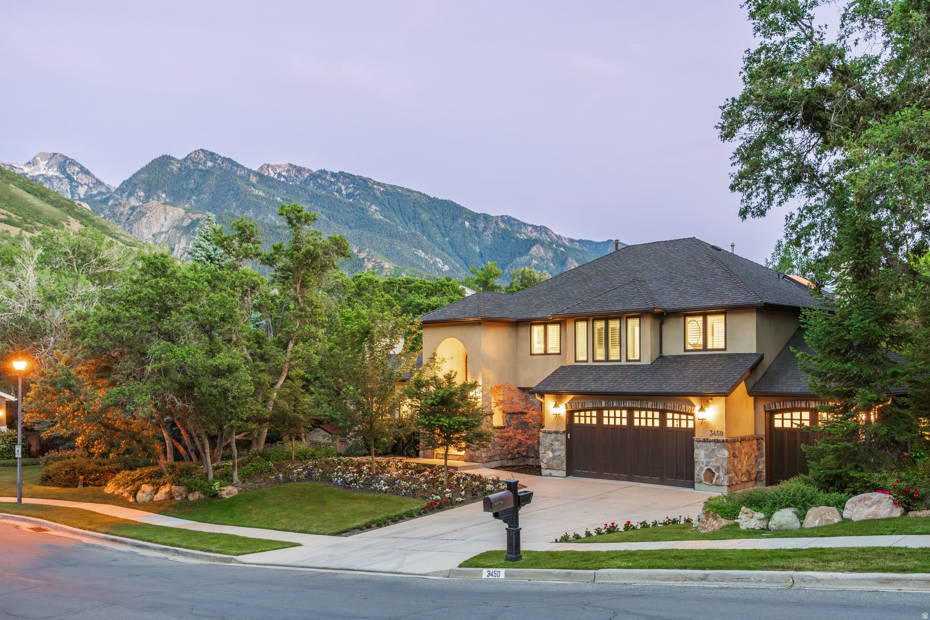 Nestled in the coveted Upper East Bench of Cottonwood Heights, this exceptional luxury residence offers over 5,200 square feet of refined living space on a private .49 acre lot with breathtaking mountain views. Featuring six bedrooms, 3.5 bathrooms, and a three-car garage, this beautifully updated home combines timeless craftsmanship, modern luxury, and an unparalleled outdoor lifestyle in one of Utah's most sought-after locations. A dramatic entry welcomes you into elegant formal living and dining spaces, a private office, all enhanced by a soaring vaulted beamed ceiling, abundant natural light, and a striking fireplace accented by a hand-carved mantel. Every detail throughout the home reflects enduring quality, thoughtful design, and a meticulous attention to detail. A newly renovated chef's kitchen designed for both entertaining and daily living is joined by a comfortable family room space, perfect combo for family get togethers. The line up in the kitchen includes Sub Zero refrigerator and freezer, Wolf appliances, six burner range, four ovens, warming drawer, microwave, and the ever popular pebble ice machine. The luxurious primary suite serves as a private retreat, featuring a delightful renovation with heated bathroom floors, steam shower, deep soaking tub and two oversized walk-in closets. Step outside to an extraordinary backyard designed for year-round enjoyment. Mature landscaping and towering trees create remarkable privacy while a resort-style swimming pool, waterfall feature, pizza oven, gas fireplace, trampoline, play set, swing, slide provide endless opportunities for relaxation and entertaining. Additional highlights include newer Pella efficient windows, plantation shutters, high efficient HVAC system, two year old 90 gallon water heater, and a 22-kilowatt propane powered back-up generator. The lowest level of the house provides walkout access to the amazing backyard for additional flexibility for family living. Located just minutes from Big and Little Cottonwood Canyons, you will enjoy immediate access to world-class skiing, hiking, biking, golf, and outdoor adventures. Shopping and dining are close and the Salt Lake International Airport is just 25 minutes away. A rare opportunity exists to purchase this property separately or together with the adjacent 3,300 ft. Luxury casita residence, creating an extraordinary multigenerational family compound. The detached residence offers a main-level primary suite, four bedrooms, 3.5 bathrooms, a two car garage and a creek that runs along the back of the house. This is an exceptionally uncommon offering in today's market.