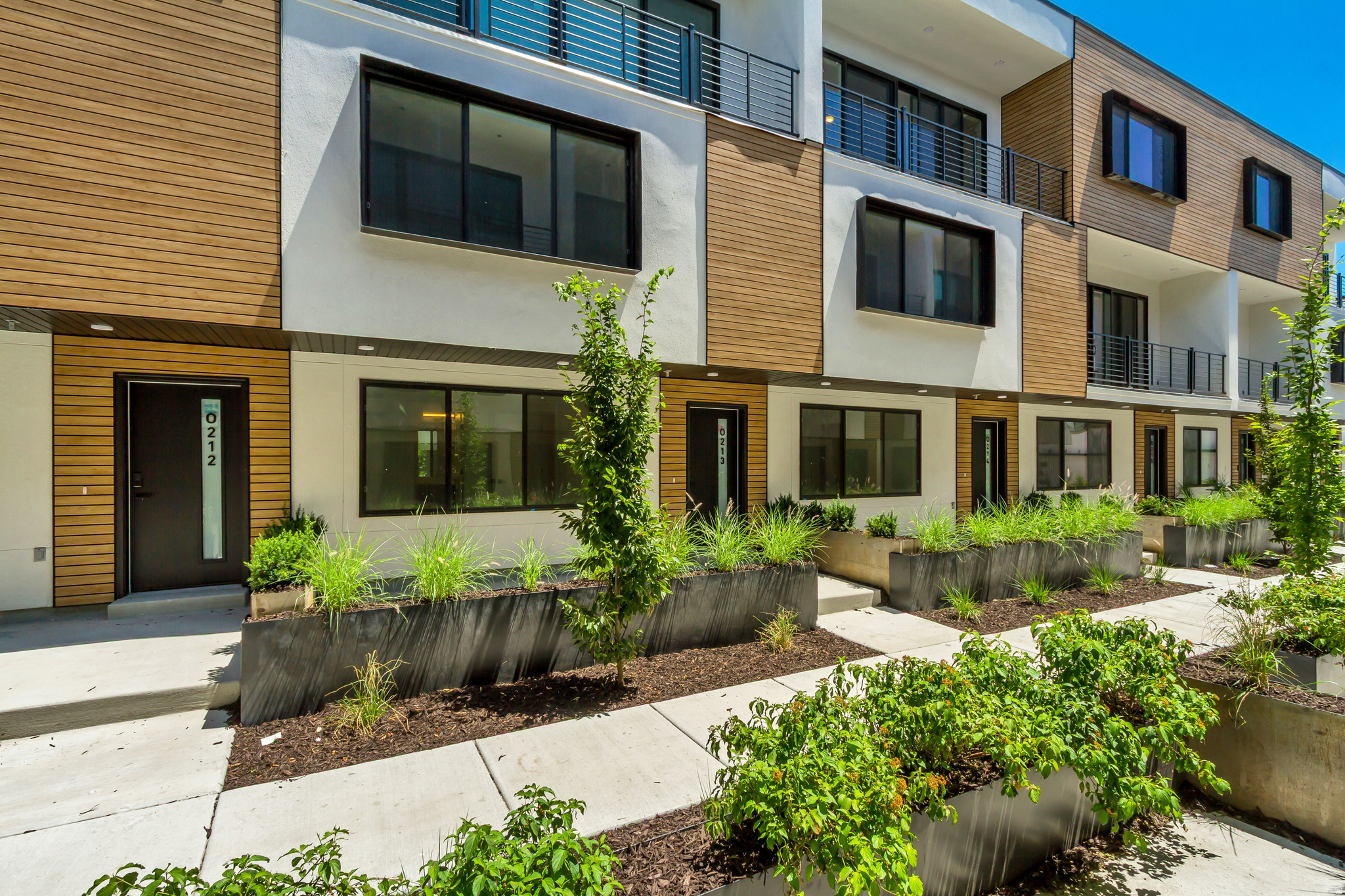 Open house visitors need to check in at the model home located at Unit B104. This home qualifies for a 3% down no PMI financing option.  Please ask us about the details.  Discover elevated living at Opus Green, a thoughtfully designed community that blends contemporary style with energy-efficient living. This distinctive all-electric townhome feature an innovative 3-bedroom layout crafted for both comfort and functionality. Inside, you'll find soaring 9'7" vaulted ceilings, an expansive living space, designer kitchen, elegant tile surrounds with glass shower doors in all the bathrooms, and modern architectural finishes throughout.  The question is, why wait when you can secure this move in ready unit today!  This unit comes included with refrigerator, automatic vertical-up-vertical-down blinds in the entire home as well as many other personalized upgrades that have been added.  Built with premium features including Pella windows, ductless mini-split heating and cooling systems, quartz countertops, and a unique floorplan unlike anything else on the market, Opus Green delivers a truly modern lifestyle. This spacious 3-bedroom, 3.5-bath residence also includes a 2-car garage with an EV charging station and smart temperature controls....and did we mention every bedroom has it's own ensuite bathroom!  Designed for those seeking stylish, low-maintenance, eco-conscious living, this home offers the perfect balance of luxury and sustainability in a vibrant new community.