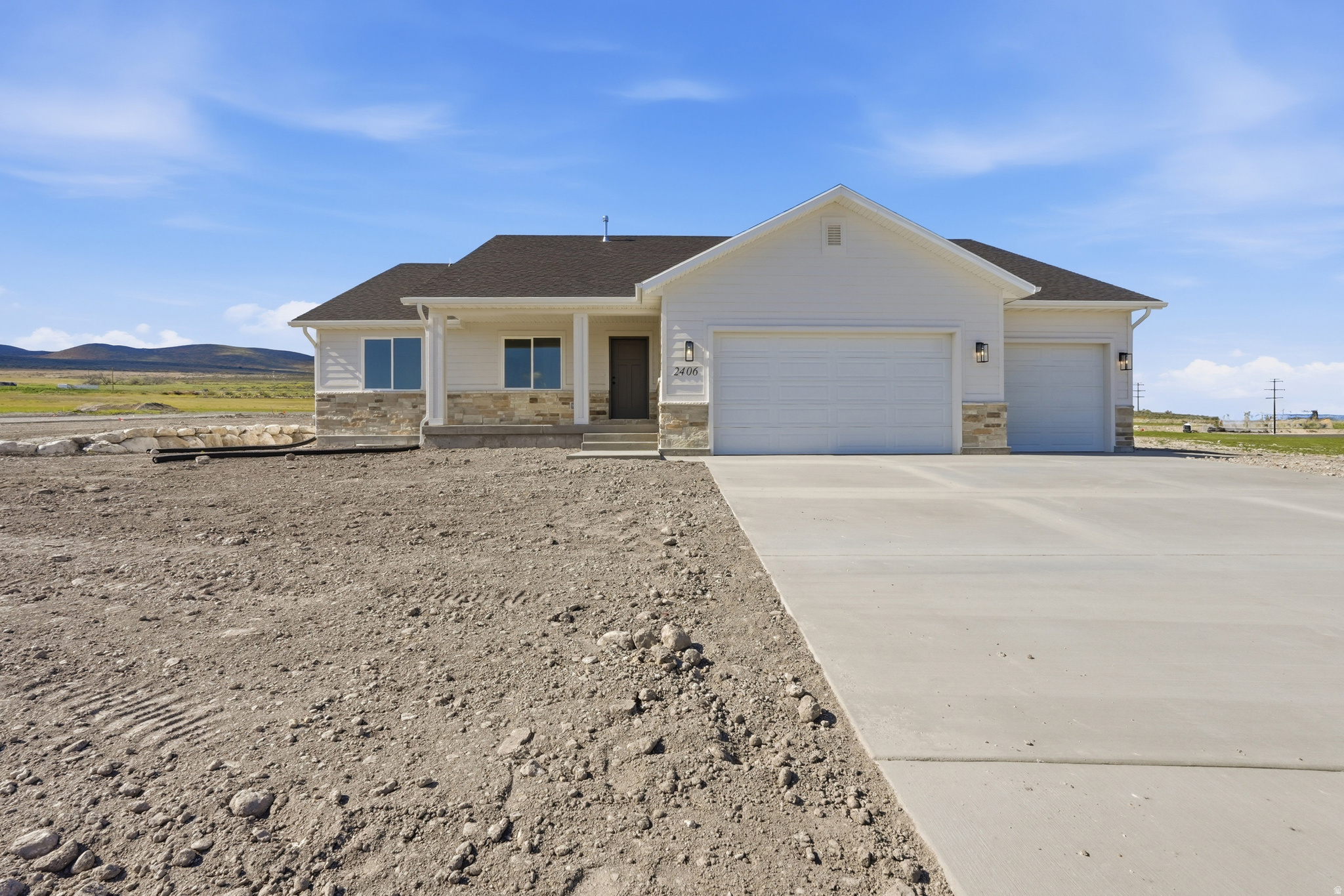 Be apart of the exciting growth in Spring Hollow phase 4 with the very first home built in this phase! This thoughtfully designed home features 3 bedrooms, 2 full bathrooms, and an unfinished basement offering room to grow and customize to fit your needs. Enjoy modern finishes, functional living spaces, and the opportunity to make this brand-new home your own! This home is conveniently located only 3 minutes to access I-15. The spacious three car garage includes an extra-deep third bay, perfect for additional storage or larger vehicles. Square footage figures are provided as a courtesy estimate only and buyer is advised to obtain an independent measurement. Agent is related to seller.