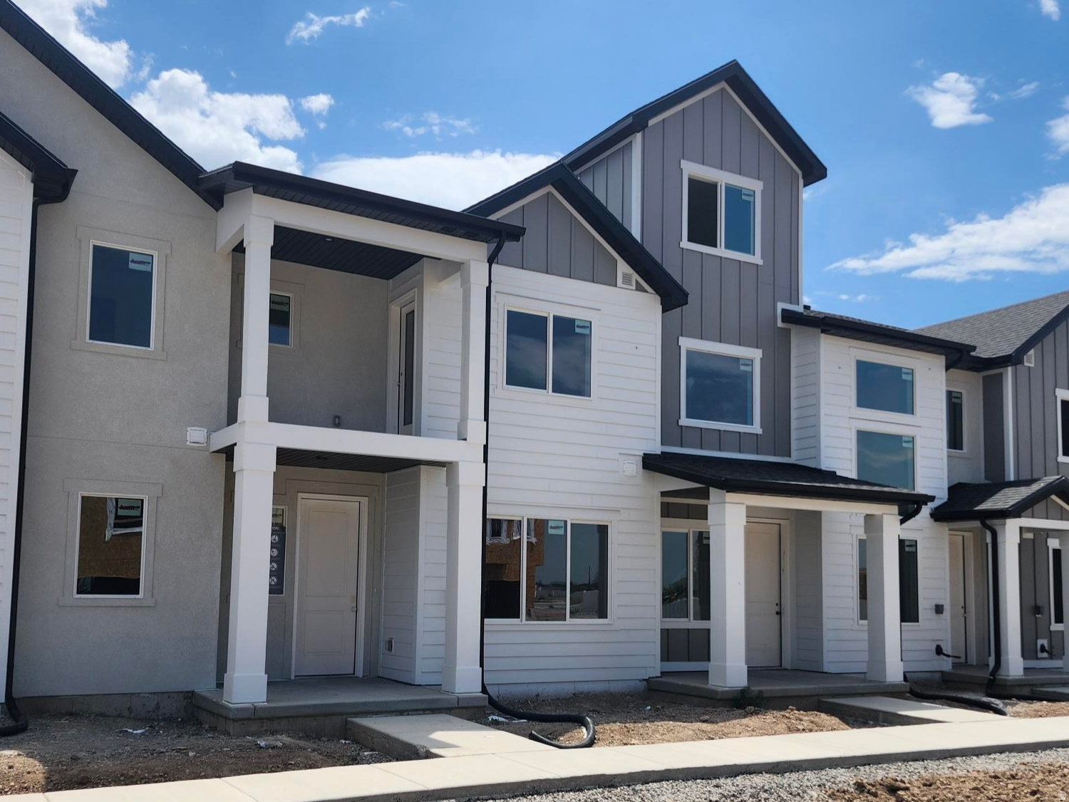 The Madison brings 1,580 sq. ft. across two levels with 3 bedrooms and 2.5 baths. An open kitchen-to-dining-to-great room layout keeps everyone connected, while a large pantry streamlines meal prep and storage. A Spacious laundry and smart additional storage help reduce clutter. Step out to your deck for morning coffee or sunset wind-downs. A 2-car garage keeps gear, bikes, and bins neatly stowed. *Unit is currently under construction, and pictures are of a finished home of the same floor plan, and the available home may contain different options, upgrades, and exterior color and/or elevation style. Square footage figures are provided as a courtesy estimate only and were obtained from building plans*