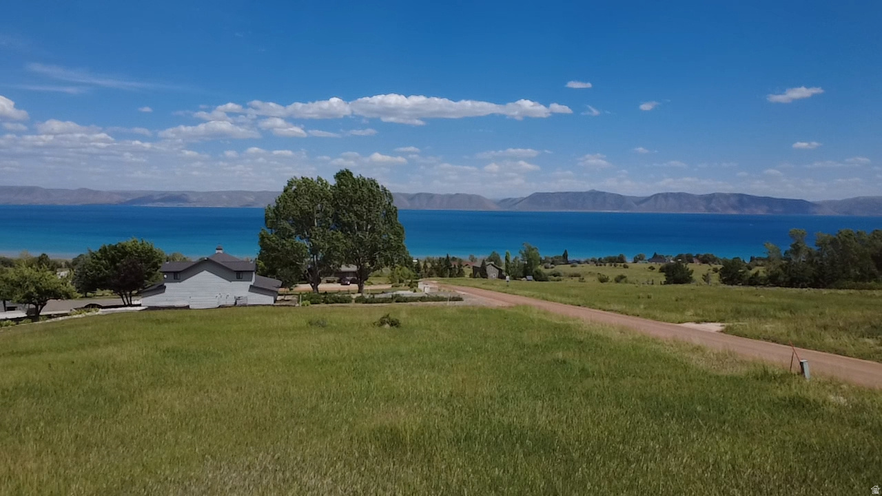 Nice Bear Lake building lot in the Lakeside area of Bear Lake West. This lot has a beautiful end to end Lakeview with the mountains and National Forest behind . Beautiful spot to build your dream home!! Year round access! Enjoy Bear Lake West amenities with lake access, swimming pool, hot tub, discounts on golf at Bear Lake West golf course.  Only minutes to year round snowmobiling and ATV trails.  Only 15 minutes to Beaver Mtn. Ski resort. This lot is fairly flat with a gentle slope and would be easy to build on.