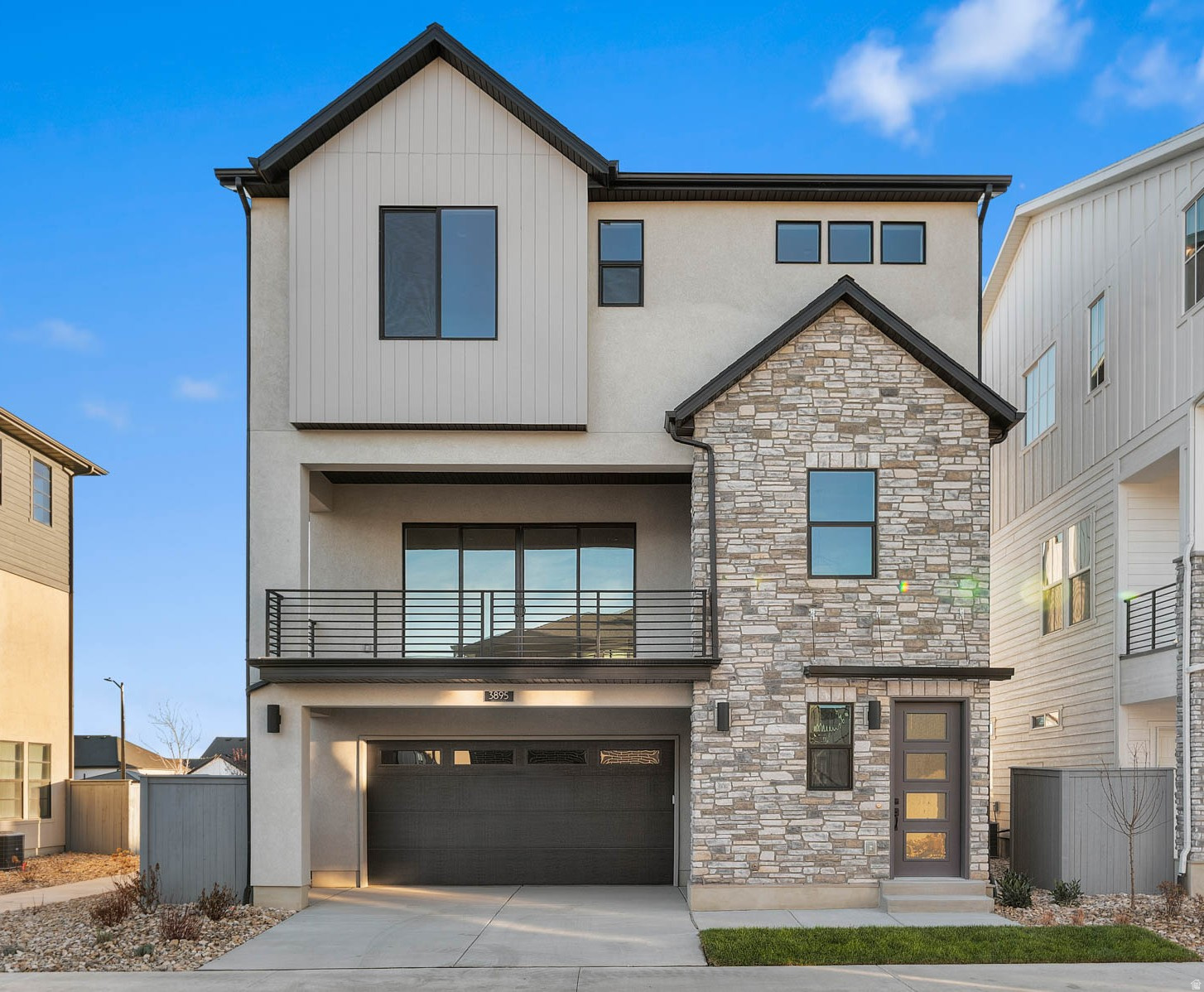 This stunning Tahoe Scandia home is appointed with elevated finishes throughout the home, all in a great Lehi master planned community!  Starting with gray maple cabinets, quartz countertops, stylish tile backsplash and platinum gas appliances that enhances the gourmet kitchen. Enjoy the inviting flow of laminate hardwood, tile, and carpet flooring. The home also includes can lighting, Christmas light outlets, and multiple energy-efficient features, along with a tankless water heater for added convenience. A cozy gas log fireplace creates the perfect great-room centerpiece. Up the stairs, the metal railing adds a modern touch, paired with classic Craftsman base and casing and fresh 2-tone paint throughout. The owner's bathroom features luxurious quartz shower surrounds and bold black matte hardware, creating a spa-like retreat. Comes fully landscaped for an easy move in experience!  A beautifully crafted home combining style, comfort, and efficiency.