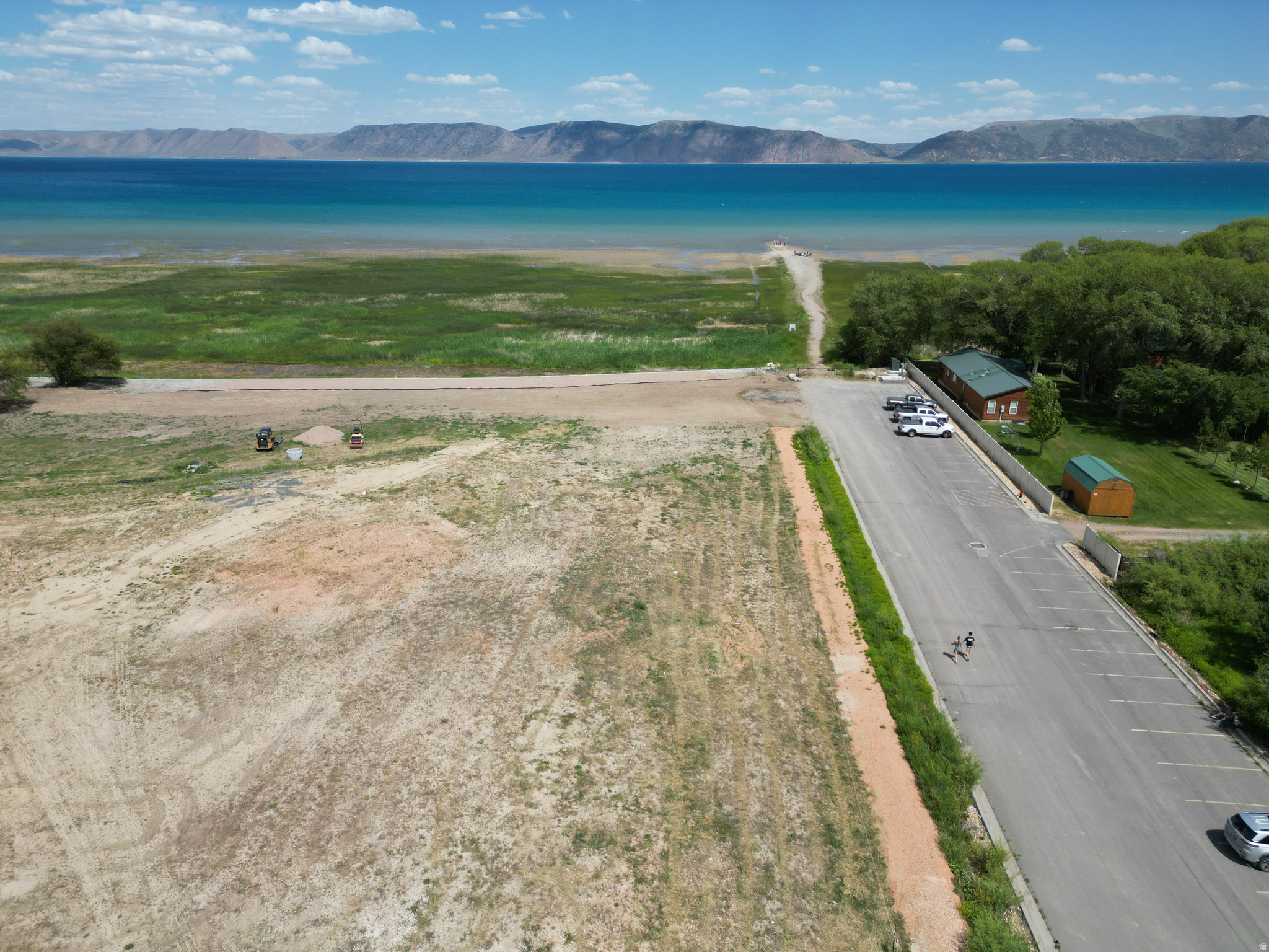 LAKEFRONT at Bear Lake in Garden City! Ideally located just one block from restaurants, shopping, and bike/walking paths, this exceptional .77-acre lot offers 94 feet of  beachfront and breathtaking panoramic views of Bear Lake. With approximately 360 feet of depth, there is ample space to build your dream lakefront home, along with a spacious garage and guest quarters or additional living space above. Opportunities to own Bear Lake waterfront property in such a convenient location are rare. Contact your Realtor today before this incredible lakefront lot is gone!