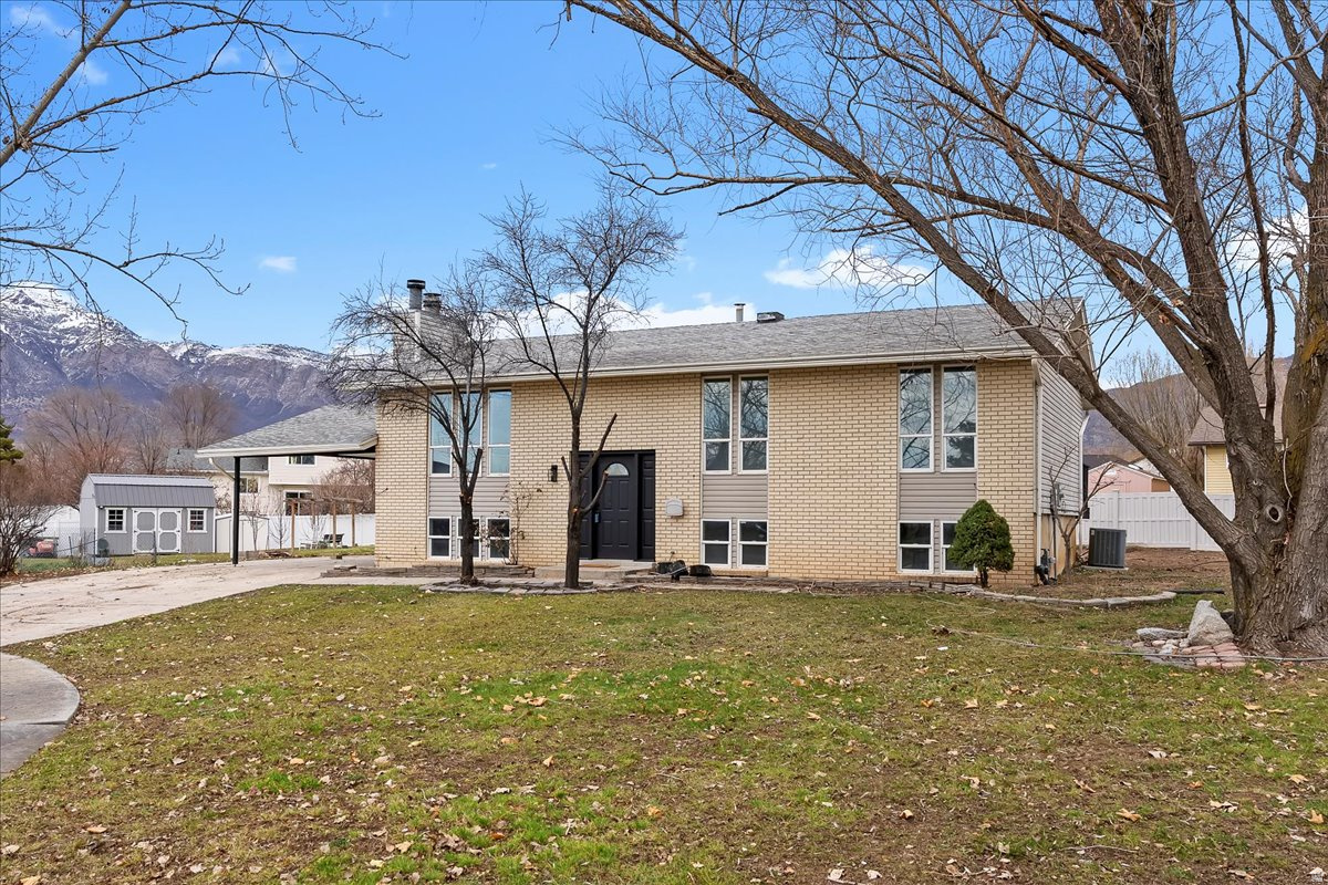 *** GORGEOUS FULLY REMODELED 5 BEDROOM HOME ON A CUL-DE-SAC *** LARGE .31-acre lot. The new kitchen features quartz countertops and white shaker cabinets. The modern bathrooms carry a clean aesthetic with completely new tile work and vanities. The home has new lighting, flooring, and paint throughout giving it a fresh, cohesive feel. The kitchen and primary bedroom both walk out to a large deck overlooking the expansive yard and stunning mountain views-perfect for indoor and outdoor entertaining. The upstairs windows stretch nearly the full length of the wall, filling the home with natural light. All basement windows are above ground, creating an open and inviting atmosphere. The basement offers two family rooms plus a versatile flex space that can be used as a fifth bedroom, home office, or art studio. Full tear off and new roof installed on 1/5. Harrisville's main park is just a short walk away and features a splash pad, playground, disc golf, and fishing pond. The home is also close to essential shopping and just minutes from the outdoor recreation Utah's wilderness is known for. Commuting to surrounding areas is effortless with easy access to major highways.