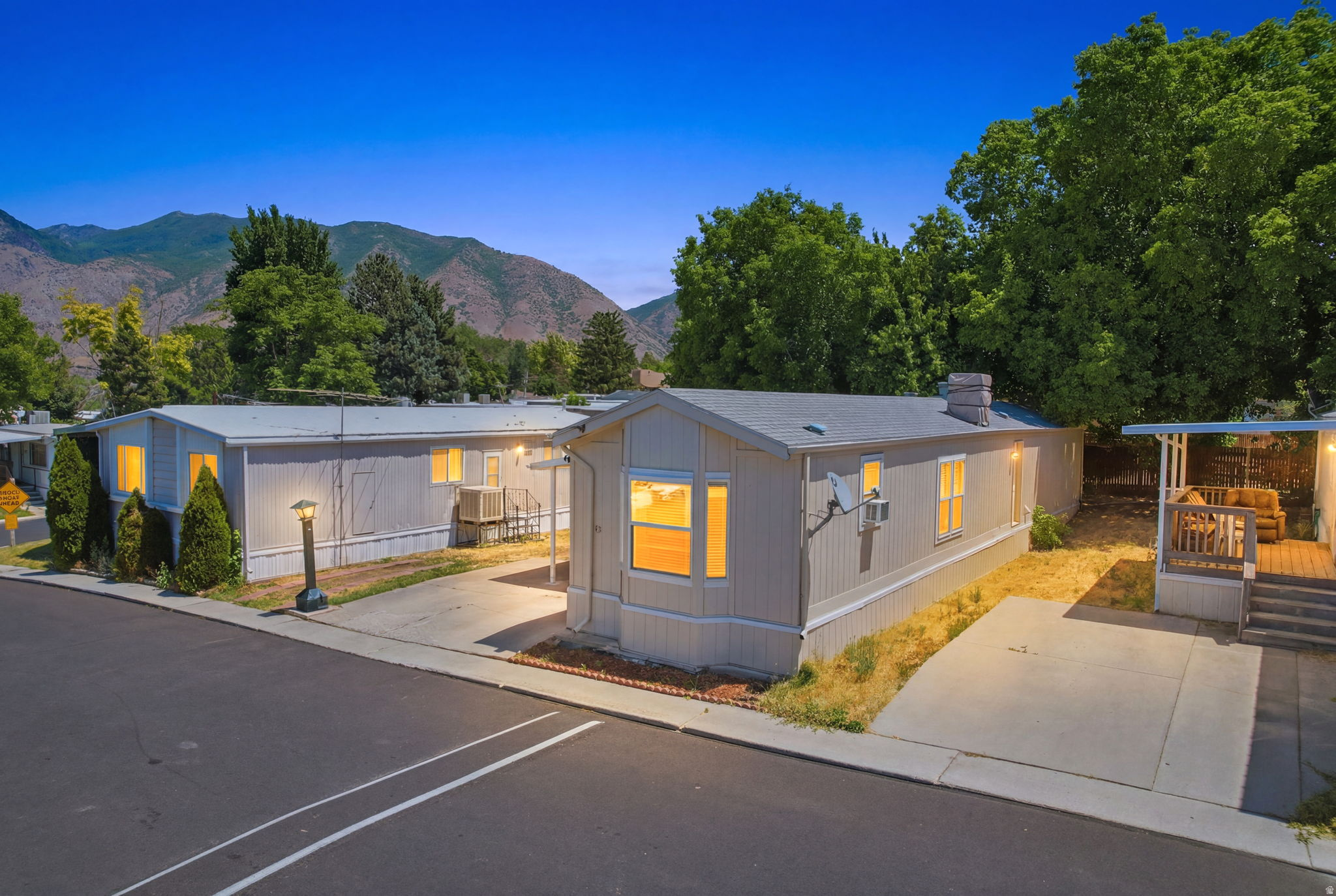 Welcome to this well-maintained 2 bedroom, 2 bathroom manufactured home located in a quiet and peaceful community in the heart of Springville. Pride of ownership is evident throughout, as the current owners have taken exceptional care of the home, making it truly move in ready.  Situated on one of the larger lots in the community, this property offers extra outdoor space to relax, garden, or entertain. It's an excellent opportunity for first-time homebuyers, those looking to downsize, or anyone seeking an affordable home in a great location.  The community offers a quiet neighborhood setting while being conveniently located near shopping, restaurants, schools, parks, and easy freeway access. Monthly lot rent is $720.  Don't miss your chance to own this charming home in one of Springville's most desirable manufactured home communities!