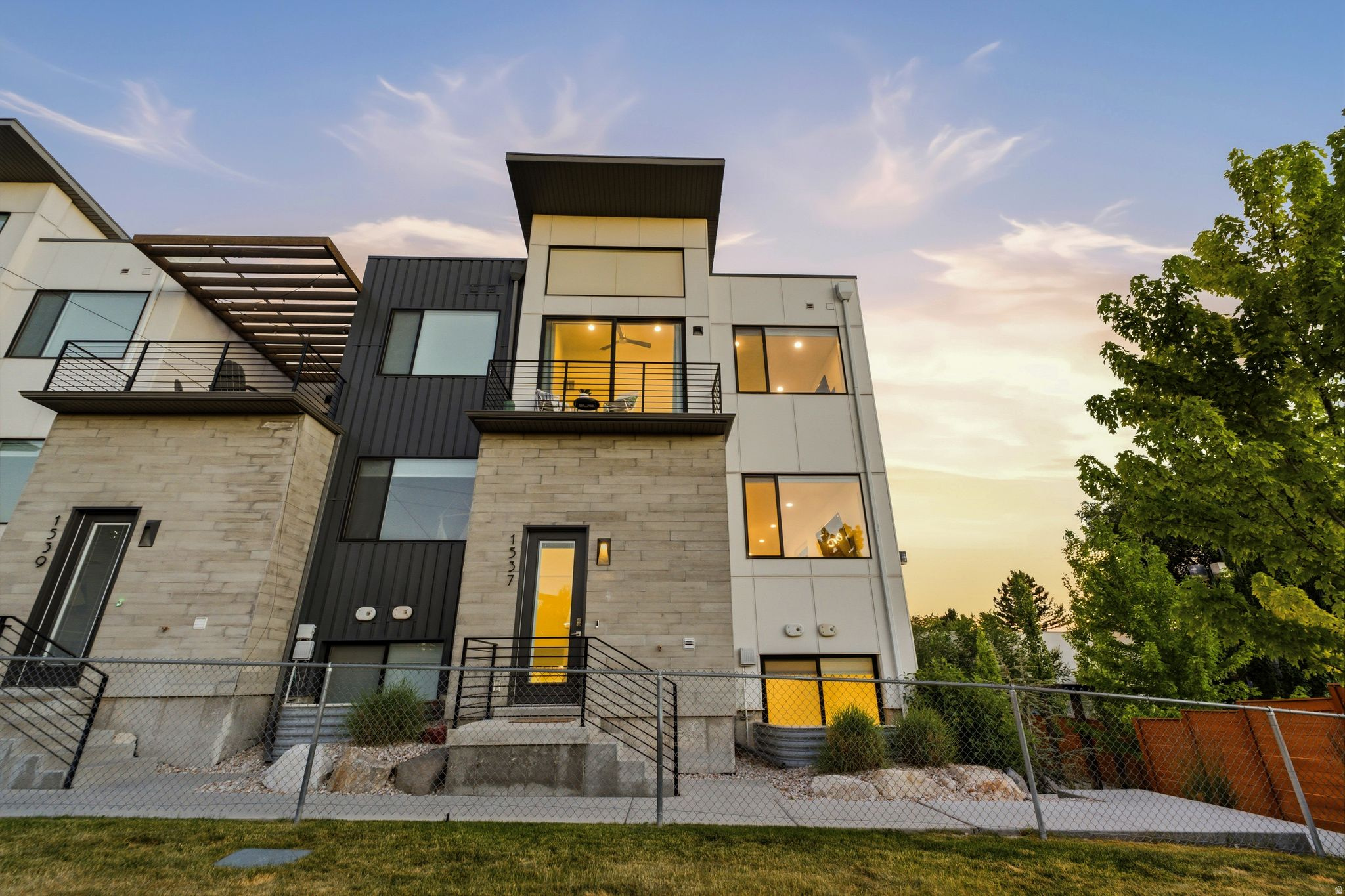 Welcome to 1537 Talo Ct, arguably the most desirable location in the entire Talo community. Situated at the end of the development, this desirable end-unit offers added privacy, abundant natural light from extra windows, and beautiful views. Designed with luxury in mind, the home features 9-foot ceilings, vaulted ceilings, upgraded appliances, designer fixtures and hardware, modern garage doors, enhanced lighting, solid wood cabinetry, solid-core doors, and LED lighting throughout. The spa-inspired bathrooms showcase Euro glass showers, floating vanities, and a freestanding soaking tub. With a bathroom on every level and a thoughtfully designed floor plan, the home blends functionality with high-end finishes. Conveniently located just a short drive from the University of Utah, Millcreek Commons, shopping and dining, and quick freeway access. This is modern living at its finest!