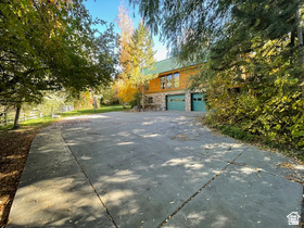 Beautiful Family Ranch with 2 log homes with Tree line entrance off Waterhole Way. Property is one of a kind and feels like a Hidden Oasis. This would make a great ranch or possibly future development. Large Barn and pasture. Property is in the heart of Grantsville just North Main Street. Larger Cabin has master suite with separate shower tub. Property includes Tax ID 01-057-0-0011 that is 10.46 acres making the total acres of the ranch 16.92 acres. Both Cabins have microwaves, refrigerators, Ranges and dishwashers that are included. Price includes 19.76 acre feet of water. Seller owns 50 shares of irrigation water they would consider selling with property at an additional negotiated price. This is a must see to believe property! Call agent for details!