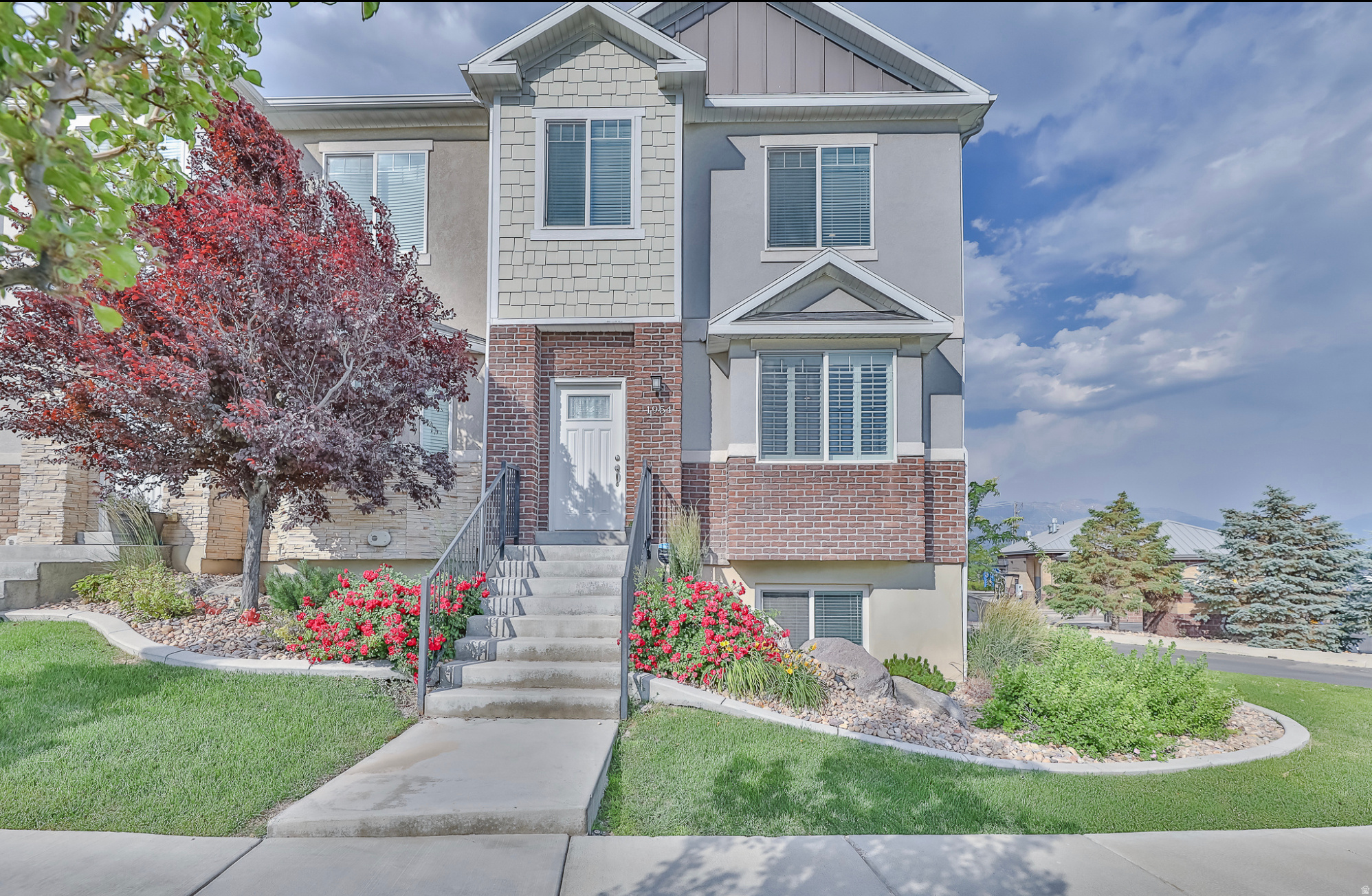 This is a beautiful townhome with an airy open feel. It is an end unit so the natural light is energizing. The location is everything great for everyday living. It is located in the north part of Saratoga Springs which makes any commute fast easy with close access to the new Mountain View Corridor, State Route 85, located near 2100 North in Lehi giving quick access to I15. Close to Walmart, and all the new restaurants and shopping in Saratoga Springs.  The layout of the home is perfection. The large living room and large kitchen are perfect for entertaining. Upstairs you have the primary bedroom  & bath, and 2 additional bedrooms, with an additional bathroom, the laundry room is conveniently located in the hallway. Beautiful granite countertops and middle kitchen island to prepare food. The basement is wonderful for gathering family and feels like you are in another home, or apartment space. The primary bathroom has an upgraded seperate shower with beautiful custom tile. The balcony off the kitchen is so relaxing and this unit is the only townhome with a full view of the mountains and valley. There is beautiful maintenance-free landscaping all year round along with snow removal covered by the HOA. The best part of Harvest Hills is all the parks and walking trails, you will have nature all around you. **More pictures of interior to come**
