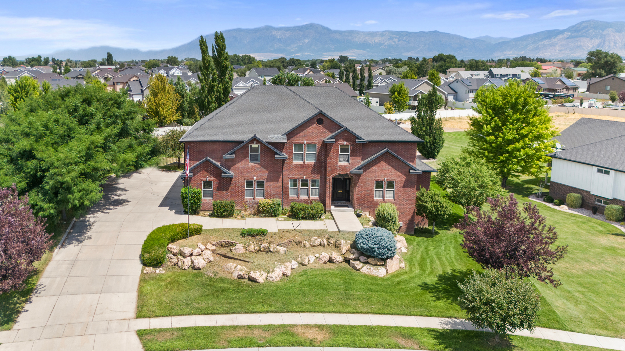 Welcome to this beautifully crafted home on almost a full acre lot in a quiet West Haven neighborhood, COMPLETE WITH A FULL ACCESSORY DWELLING UNIT BASEMENT. This 6,695 sq ft estate offers exceptional space and comfort. Features three fireplaces-one on each level-creating warm, inviting gathering spaces. The spacious primary bedroom suite includes a private en suite bath, while two Jack and Jill bathrooms provide added convenience for family and guests. Additional highlights include a walkout basement, tankless water heater, hidden walk-in pantry, theater room, workshop & plenty of storage.. all surrounded by mature landscaping.  HOT TUB INCLUDED. Buyer to verify all info.