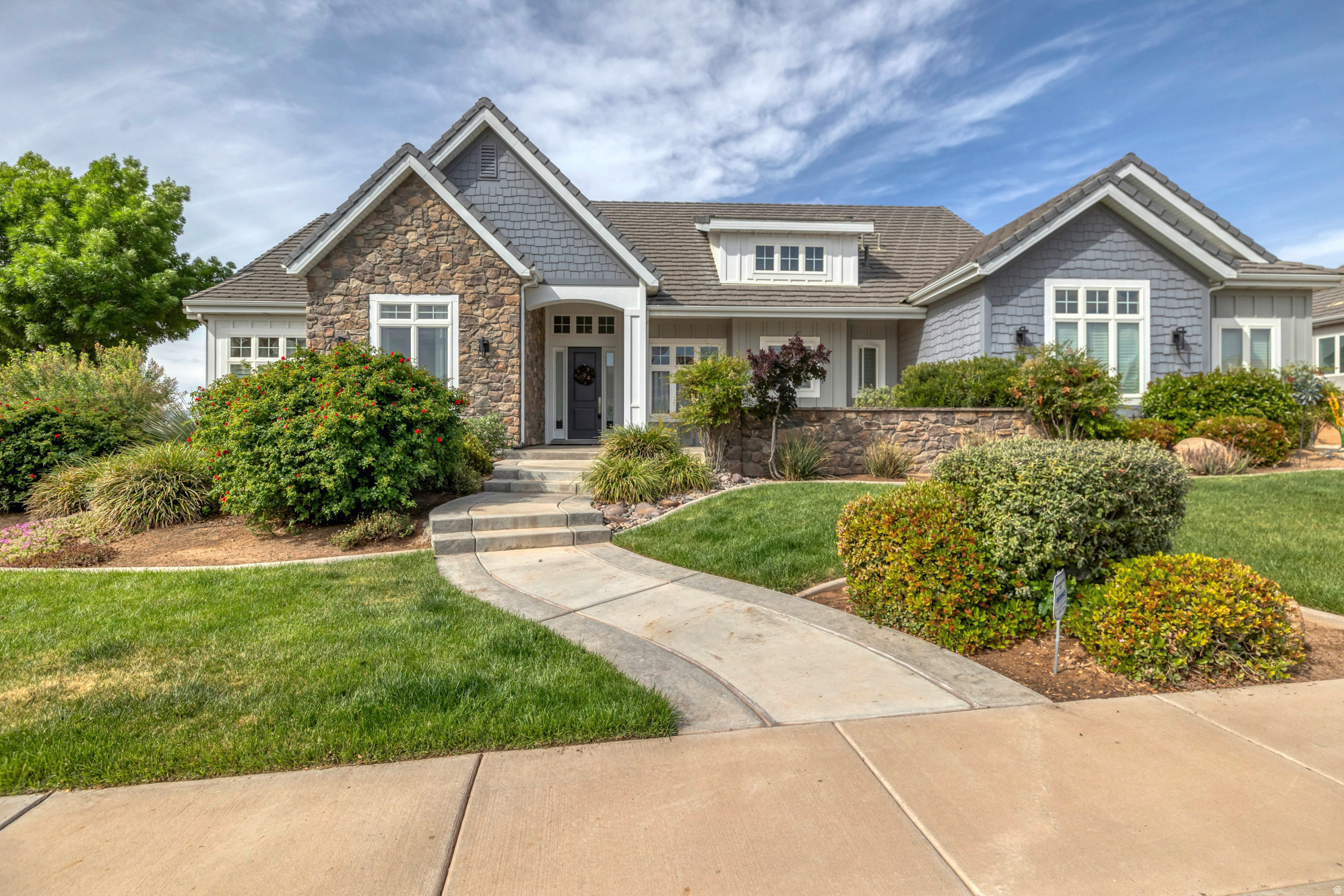 Location! Location! Location! Views, space, and a location that's hard to beat. Located on the ledge of Foremaster Ridge, this stunning home overlooks St. George and offers the kind of views you'll never get tired of. From the moment you walk in, the home feels bright, open, and welcoming with a layout designed for both everyday living and entertaining. Tons of windows fill the home with natural light while showcasing the scenery. Several bedrooms feature en-suite bathrooms upstairs and downstairs, plus the walk-out basement opens from multiple rooms for added convenience and flexibility. Tall ceilings throughout create a spacious feel, while tray ceilings in the primary suite add character and charm. Featured in the Parade of Homes in 2013, this home is a rare opportunity in one of St. George's most desirable areas. Buyer and Buyers Agent to verify all information.