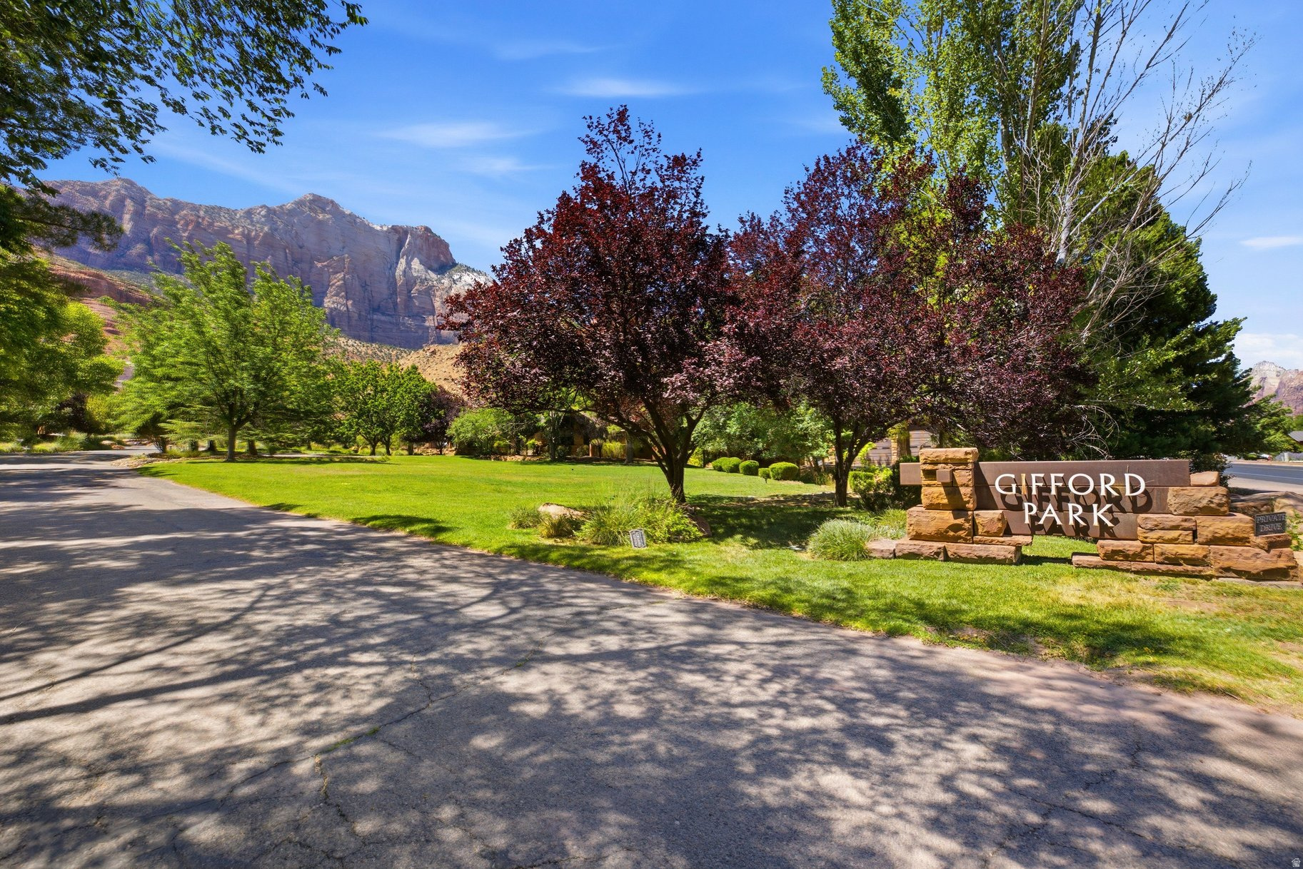 Beautiful greenery surround this home site in Gifford Park along Zion Park Blvd. The maintenance-free development sits on 9 acres with only 13 home sites. Close to restaurants, shops, shuttles and hiking trails, you'll enjoy all that Springdale and Zion have to offer, all within walking distance. All homes are built of iconic red sandstone resembling the buildings in the National Park, creating an architecturally cohesive community. If you want to live close to town, this is the home site for you!