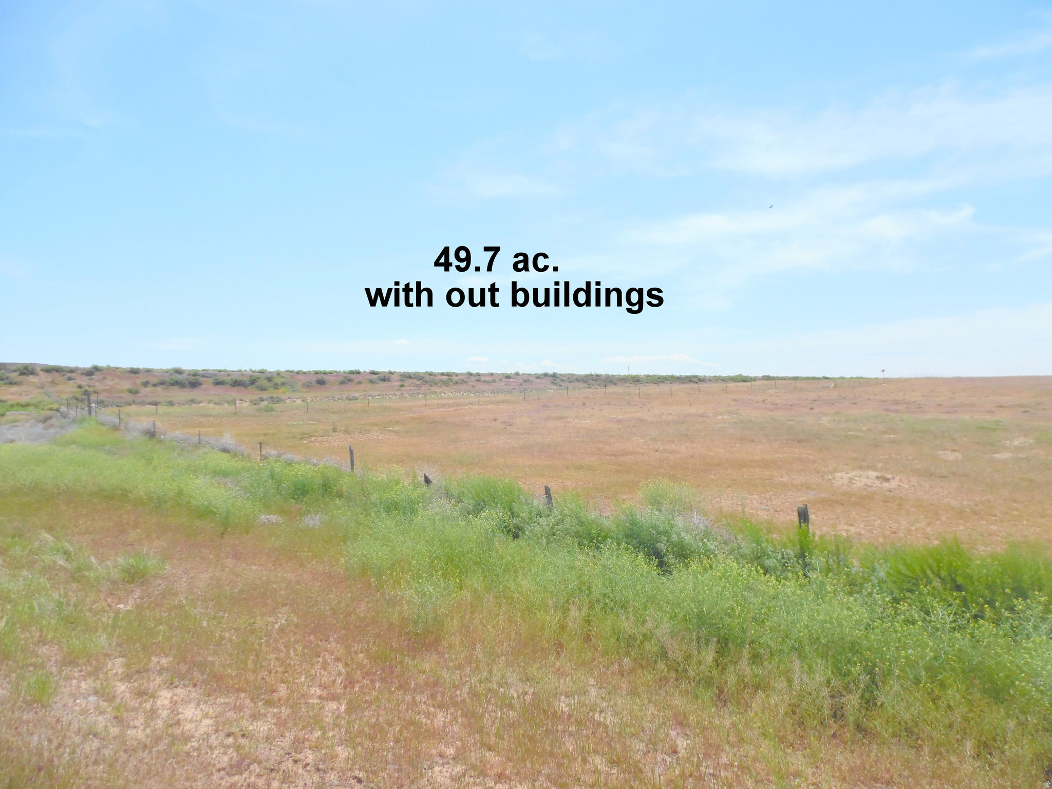 49.7 ac. Lots and lots of land and lots and lots great views of rolling hills, the La Sal Mts. and the Book Cliffs. And if that isn't enough, it comes with a 3-bd. 1-ba. home that's in the process of being remodeled and updated. There are two metal building on the property (a great place to store all your stuff and the new stuff you're going to buy). The owner has a number of empty commercial tanks and containers on the property which will all be removed soon. Directions: Located just off the Westwater exit (227). At the stop sign head north, the property is on your left starting with the big fenced empty field. Looking at the aerial map, it appears there was once an air strip on the property that is now overgrown, but with a little bit of work could have new life.  The property has KEEP OUT signs on the property. The selling agent will need to be at all showing. This listing will also be listed on the residential Multi Listing Service (MLS). All information herein is deemed reliable but is not guaranteed. Buyer is responsible to verify all listing information, including square feet and acreage, to buyer's own satisfaction. Square footage figures are provided as a courtesy estimate only and were obtained from county records and have not been verified by broker or MLS. Buyer is advised to obtain an independent measurements to verified for accuracy.