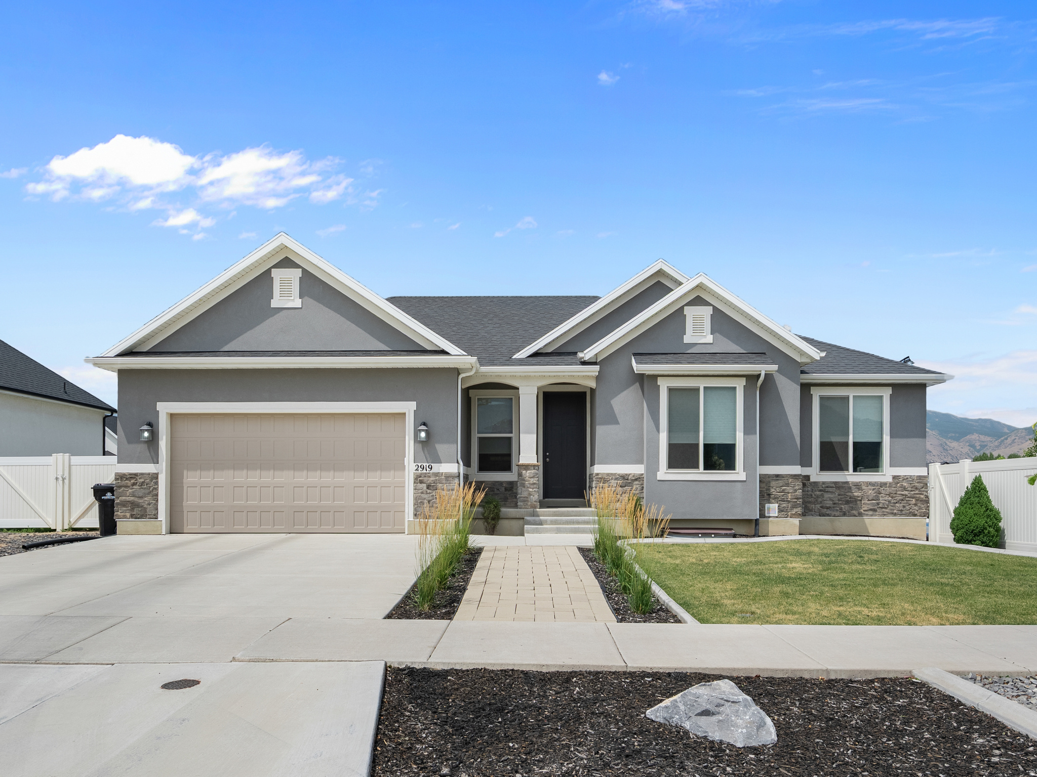 Beautiful home in a highly desirable, newer Spanish Fork neighborhood - perfectly positioned directly across from Maple Mountain High School. Fully finished, light-filled layout featuring vaulted ceilings, custom-built fireplace with elegant accent walls, granite countertops, and an off-the-garage mudroom with built-in bench and storage. The highlight of the home is the stunning private home theater: stadium-style seating across 3 tiers, 12 premium recliners, built-in kitchenette and storage, massive 142-inch screen with 4K projector, and immersive 9.2.2 surround sound - ideal for movie nights or game days. Outside, features an expansive 1,000 sq ft covered patio overlooking a beautifully landscaped, fully fenced yard. Pre-plumbed gas lines connect to the home for easy addition of a future fireplace, fire pit, and grill. Enjoy your own private pickleball/basketball court with in-ground hoop and built-in lighting. Ample RV parking adds versatility. Additional perks include conduit ready for powered shed, existing electric hookups for a hot tub (not included), no HOA fees or restrictions, and a fantastic community park just 1 block away featuring pickleball courts, basketball court, dog park, playground, and open grass areas. This move-in-ready gem combines luxury finishes, smart future-proofing, privacy and freedom at an unbeatable location!
