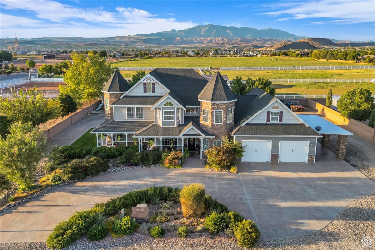 This charming Victorian-style home, zoned for HORSE PRIVILEGES, is tucked away in a quiet cul-de-sac and has city approval for a second dwelling next to the primary residence! It includes two additional parcels-one is 1.20 acres and the other is 0.92 acres, offering space, privacy, and incredible potential.  Inside, you'll find beautiful flooring throughout, granite countertops, Caf appliances, and tons of storage-including an 845 sq ft garage. There's also a gorgeous front porch, a circular drive in front, plus a driveway that wraps all the way around the house. The home features 4 bedrooms, 2 full baths, 2 half baths, and 2 family rooms-plenty of space and flexibility. This is more than a home-it's a rare opportunity to own a private retreat with room to expand. Buyer to verify all information.