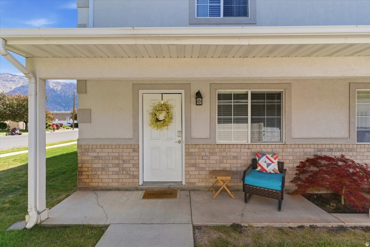 Updated end-unit townhouse featuring 2 spacious bedrooms and 1.5 bathrooms. This move-in ready home offers fresh paint throughout, LVP flooring, updated kitchen with stainless steel appliances and updated bathrooms. Refrigerator, washer, and dryer are included for added convenience, with TVs negotiable. Enjoy relaxing on the large back patio overlooking open green space with stunning mountain views. Additional features include a smart thermostat, 1-car garage, and an adjacent dedicated parking stall. Conveniently located near shopping, dining, parks, schools. Great opportunity to own a well-maintained home in a desirable location!