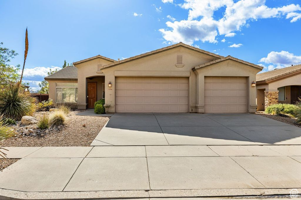 Open Floor Plan Beautiful home with great features. 4 Bedroom 2 Bath with Two-sided fireplace between living and great room, built-in bookshelves, large open kitchen/dining/great room. 8' tall doors on 3rd-car garage, extra deep on 3rd car side. Close to Freeway, Zion NP, and shopping. Clubhouse features indoor and outdoor pool, weight room, tennis and pickleball courts. Development has walking trails and playgrounds with Basketball courts. This is a great place to call home!!