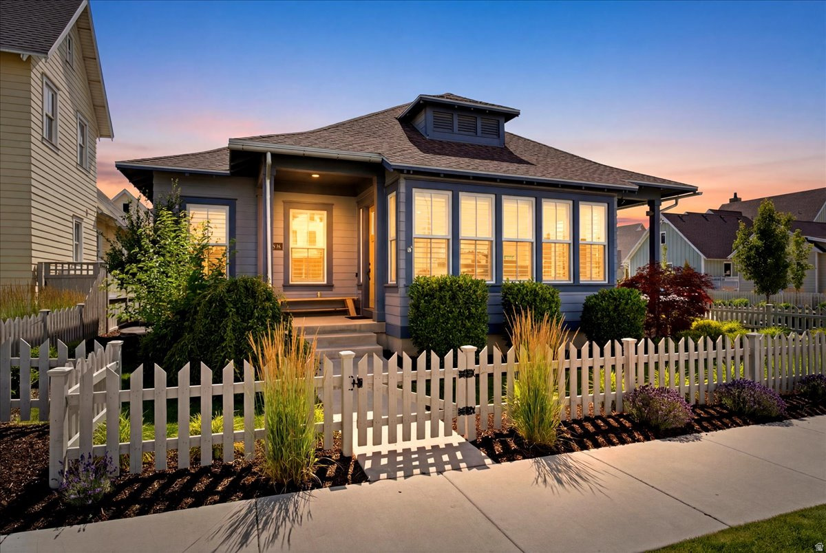 Experience elevated living on Daybreak's exclusive Island. This beautifully upgraded 5 bedroom, 4 bath home features vaulted ceilings, transom windows throughout the first floor, upgraded built in shelving, granite countertops, and an upgraded built in refrigerator. The desirable corner lot offers spacious living areas, a private hot tub, and a 2 car garage with a custom wood workshop approximately 11' by 17', complete with a ventilation and air filtration system. The basement includes a dedicated theater room constructed with double sheetrock walls for enhanced sound deadening-an ideal space for immersive movie nights or gaming. Enjoy access to one of Utah's most sought after walkable communities with nearby trails, parks, shopping, and dining. Luxury, comfort, and lifestyle come together in this exceptional home.