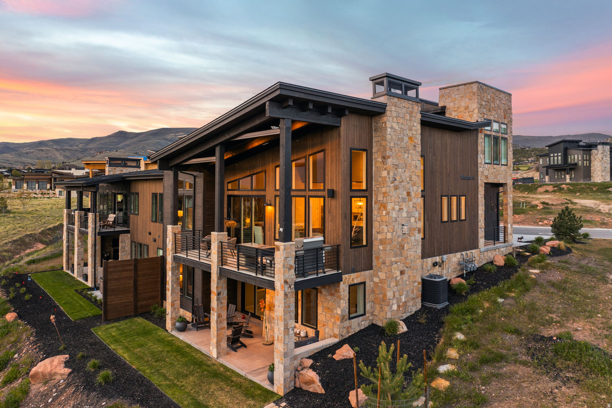 Welcome to the Red Ledges Park View Villas, an updated end-unit residence offering 3 bedrooms, 3 bathrooms, and a sought-after main-level primary suite. Bright and open with vaulted ceilings and expansive windows, this home captures unobstructed mountain views and abundant natural light. The adjacent homesite has been donated to the Red Ledges Foundation, providing long-term view preservation and added privacy. Wood flooring extends throughout both levels and is complemented by custom motorized blinds and integrated Sonos speakers throughout the interior and exterior. The walkout lower level features two additional bedrooms, including one ensuite, a spacious family room, private patio, and lawn area. The attached 2-car garage includes overhead storage racks and an electric vehicle charger. Additional upgrades include custom laundry cabinetry, upgraded shower glass, custom light fixtures, and wood ceiling detail in the kitchen. Over $50K in custom upgrades. Golf Park membership is available for purchase separately. Property is sold unfurnished.