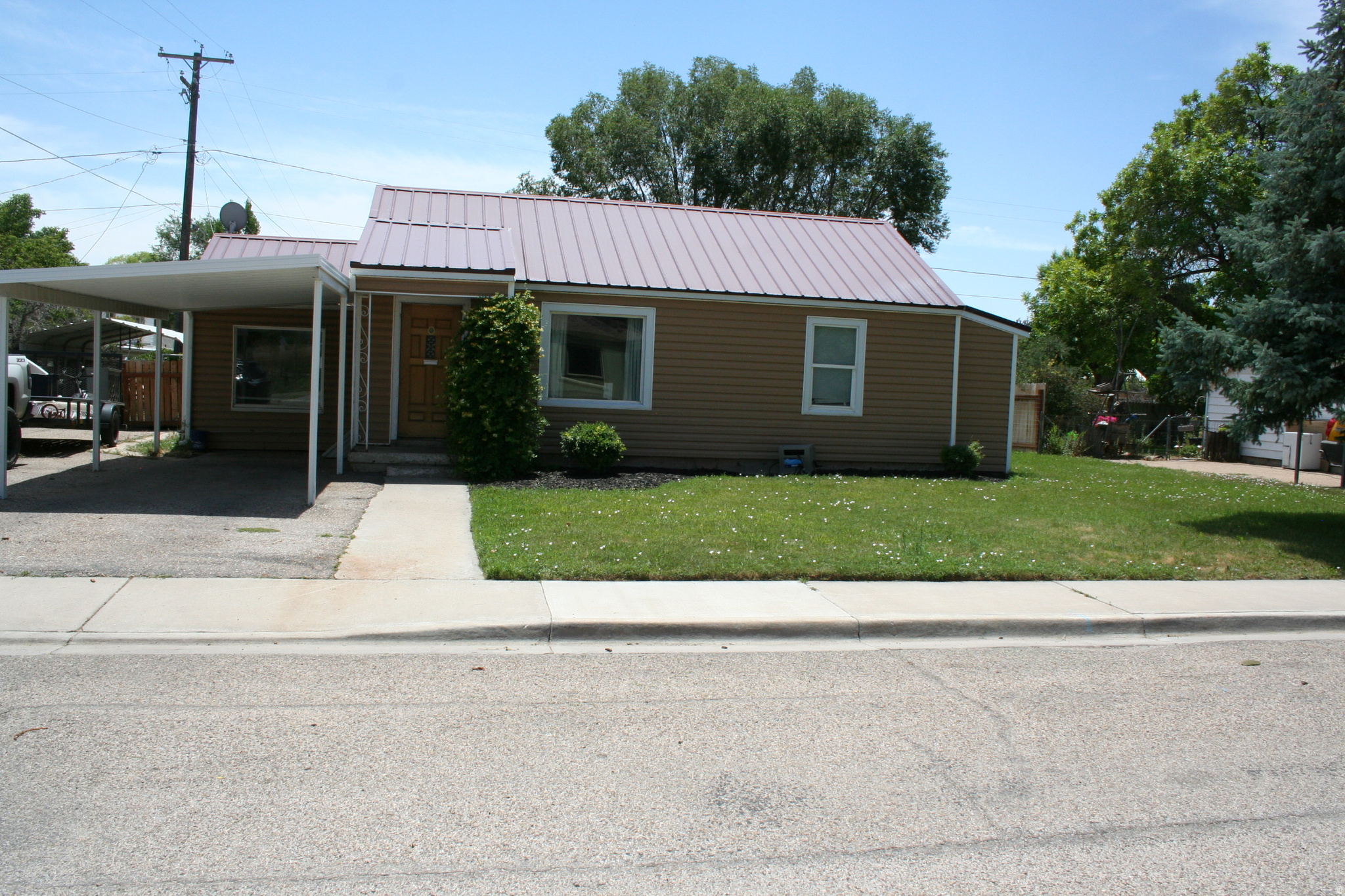 Inviting one-level home with three bedrooms and a nicely updated bathroom, offering two spacious living areas and a beautifully remodeled kitchen completed in 2025. Packed with character, this home features a fully fenced yard, a shed, and a carport with ample parking. Offers warmth and modern conveniences. Just steps from a recreation center, this well-priced gem offers abundant space and potential-truly a unique find! Square footage figures are provided as a courtesy estimate only and were obtained from county records .  Buyer is advised to obtain an independent measurement.