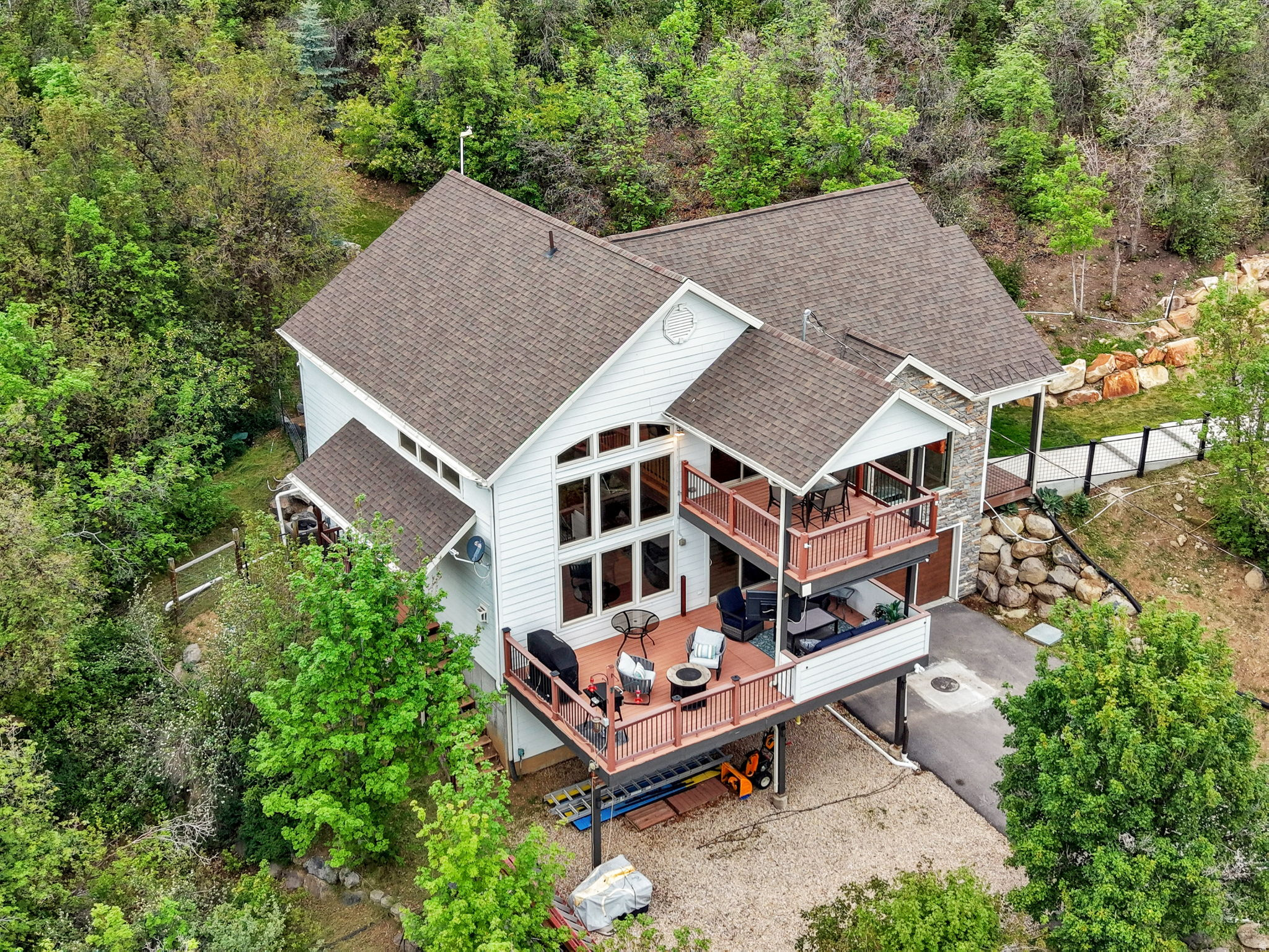 Year round living in Midway, Includes 2 parcels of land with opportunity to build on second lot for total of a 1.11 acre lot.  Includes 10 shares of Oak Haven Water on each lot for year round living on main plowed road.  Nestled amidst towering trees and serene landscapes, this cozy retreat is the perfect home or weekend getaway.  Extensive updates that you must see to appreciate, heated sidewalk with hydronic system, new bath, granite counter tops,  2" wood blinds, LVP flooring, carpet, fresh paint, master on main with walk in closet, new water softer,  all updated roof, HVAC and AC and 2 Water Heaters in 2021.  Enjoy additional 130 feet of RV parking. Must have an appointment to view. Clink on TOUR for the full experience.