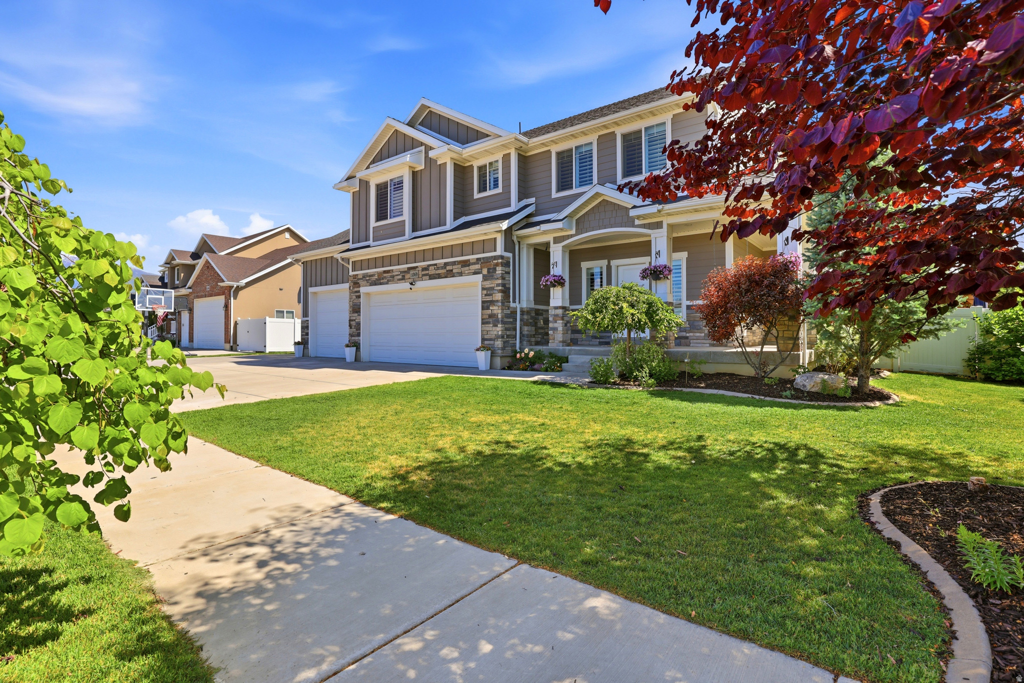 Beautiful north-facing, two-story home built in 2015 with 4,325 sq ft of thoughtfully designed living space on a .24-acre lot. This versatile home offers six bedrooms and 3.5 baths, plus a finished basement that includes a bedroom and full bath, a theater/family room, and a kid-friendly mini rock-climbing wall. The kitchen is a chef's dream with granite countertops, a spacious island, and abundant counter and cabinet space. Plantation shutters run throughout for timeless style and light control. The luxurious master suite features an extra bonus room that can be turned into a home office, workout space, or dressing area.  Additional highlights include an extra-wide, deep four-car garage, and a backyard perfectly suited for entertaining and play. Close to the new corridor and freeway, Layton Hospital, grocery stores, biking/walking trails, and a wide range of dining options. A rare blend of space, features, and location-perfect for growing families seeking comfort and convenience.