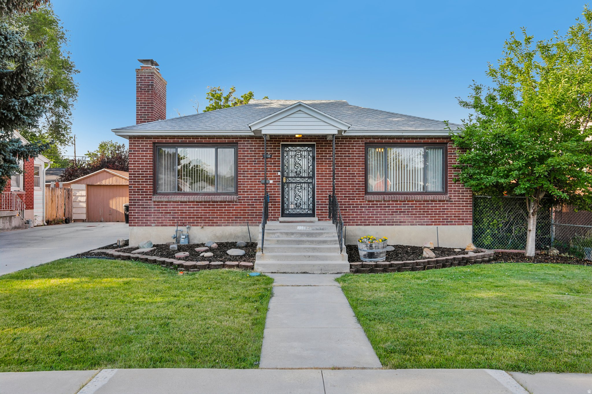 Tucked into the heart of Millcreek, this solid brick mid-century home is full of charm and character. Original hardwood floors and great built-ins set the tone throughout, while two fireplaces-one wood-burning, one gas-make for cozy nights in. The updated kitchen and bathrooms bring modern comfort without losing the home's warmth, and the spacious family room flowing off the dining area is made for gathering with people you love. Step outside to a covered patio and a garden with producing grape vines, plus a Tough Shed and an oversized two-car garage with workbench for all your projects and storage needs. And with easy access to I-15, I-215, the 21st South Freeway, and I-80, you're just minutes from Millcreek Commons and Sugar House, and a quick drive to downtown SLC, the U, and beyond. Buyer to verify all information.